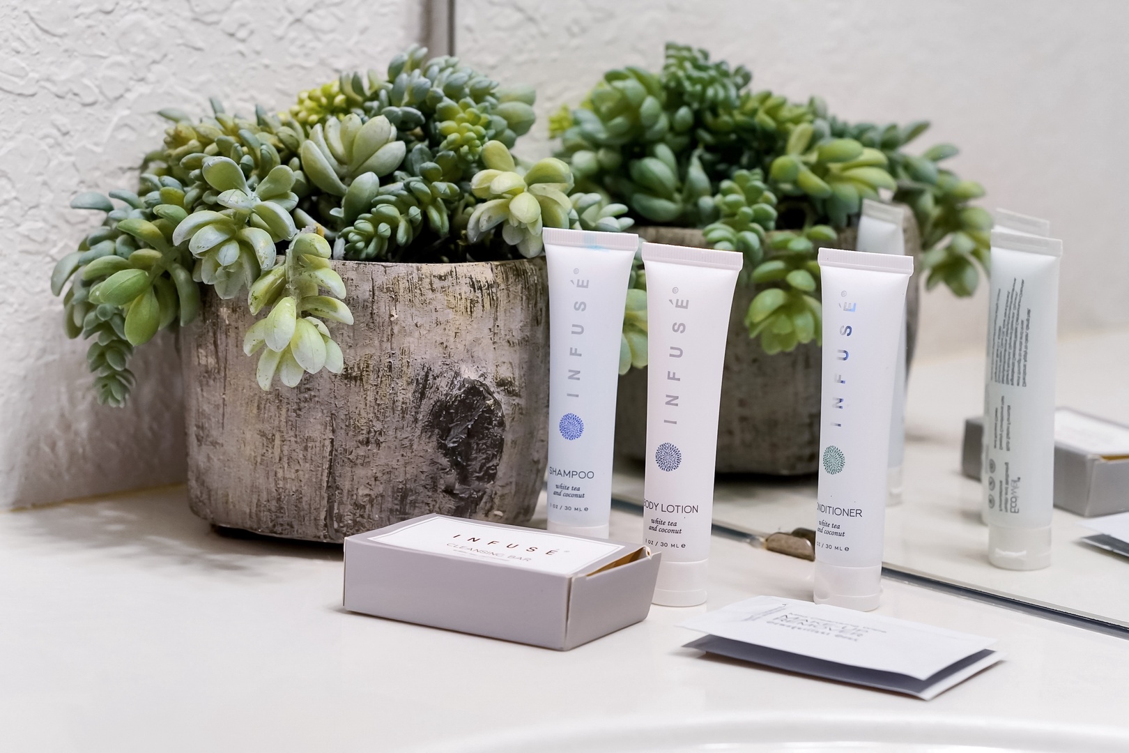 Unwind with thoughtful touches in your bathroom, where premium bath amenities and charming succulent décor set the scene for a relaxing refresh.