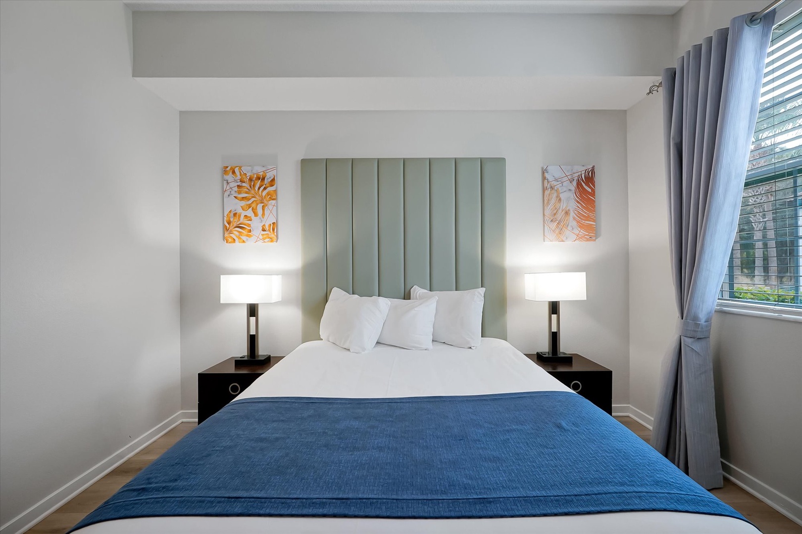 Sink into crisp white linens and soft pillows after your day exploring, while warm bedside lighting creates the perfect ambiance for relaxation.