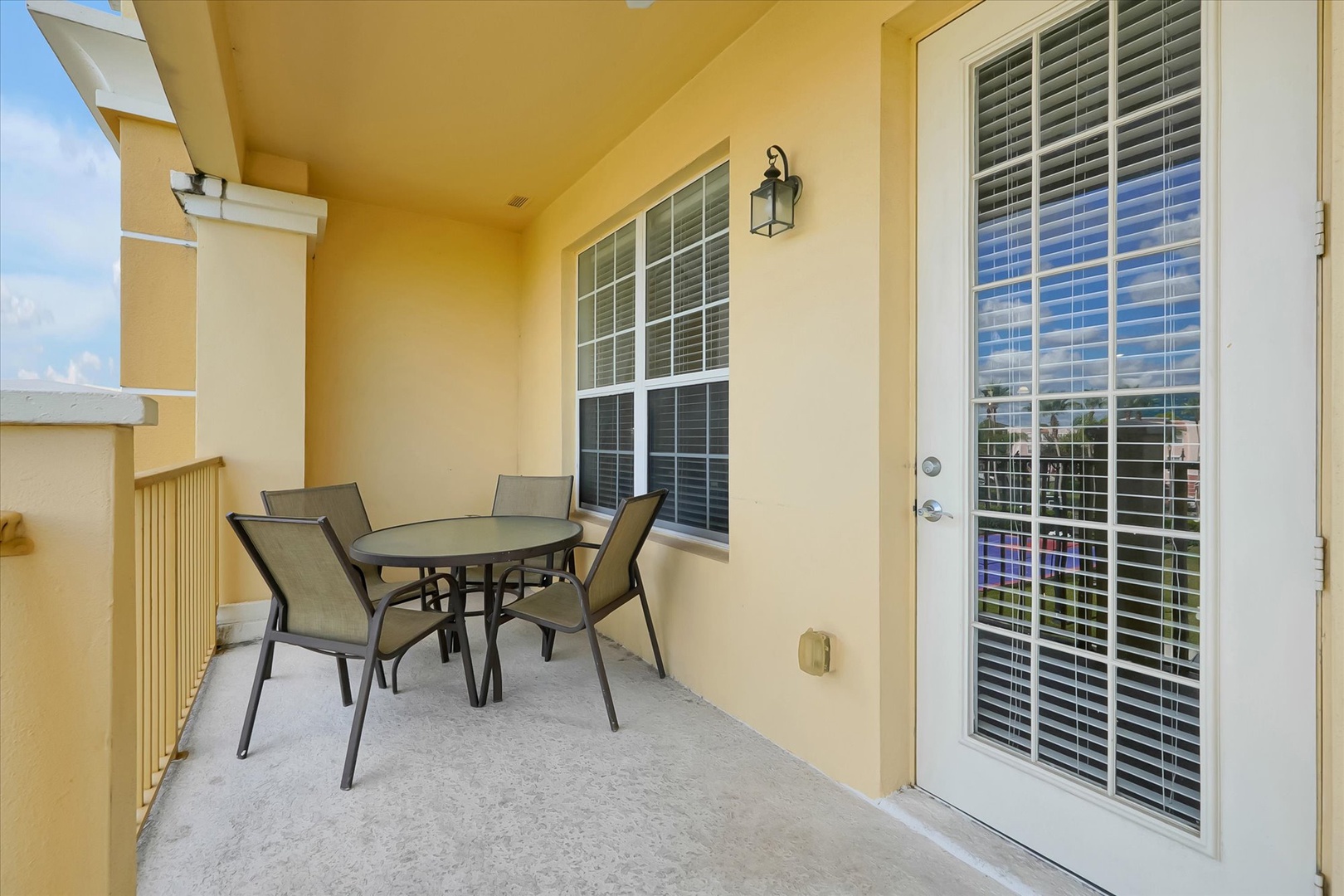 Enjoy morning coffee on your private covered balcony with dining table and chairs, perfect for al fresco meals.