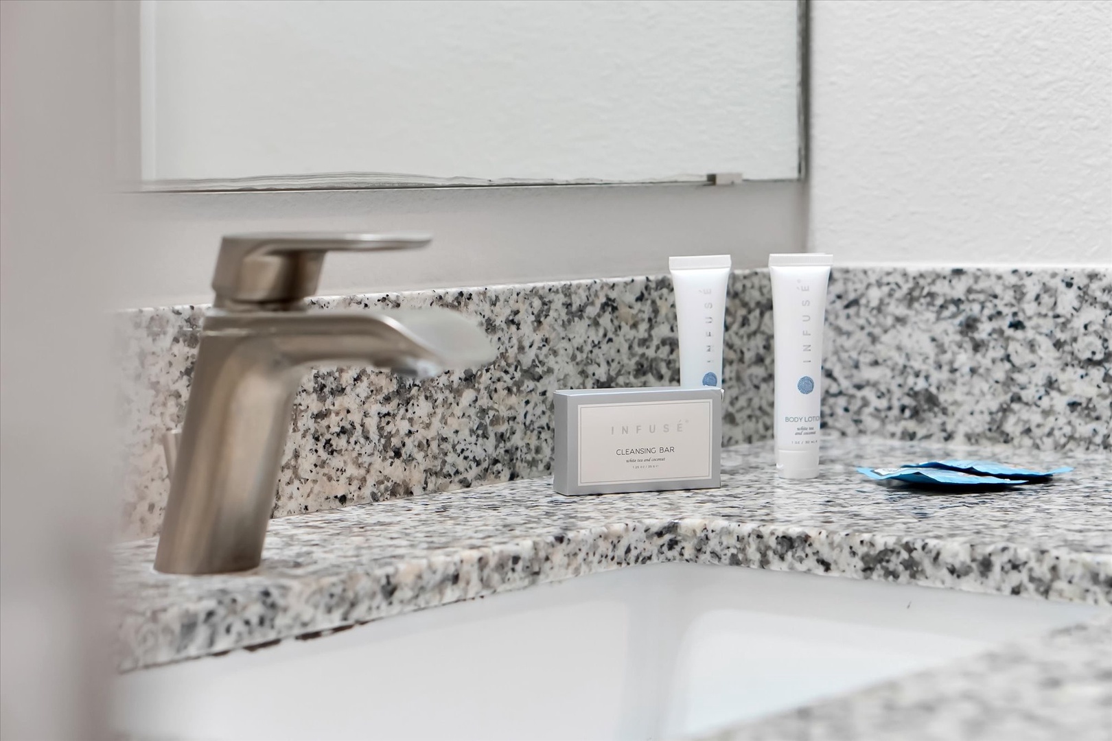 Freshen up at your elegant granite vanity with premium amenities thoughtfully arranged for your comfort and convenience.