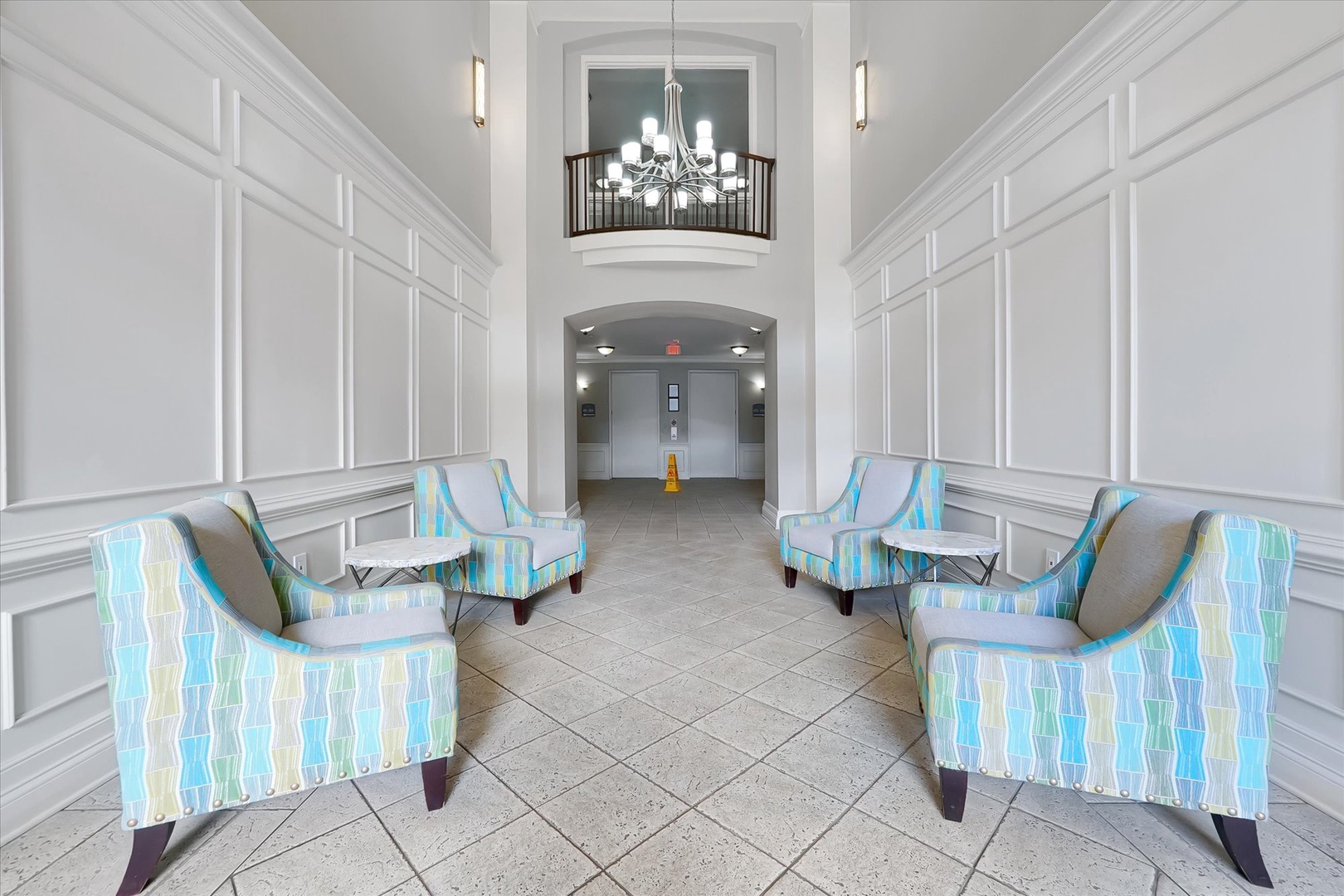 Elegant lobby with sophisticated seating and stunning chandelier detail overhead creates an impressive first impression.