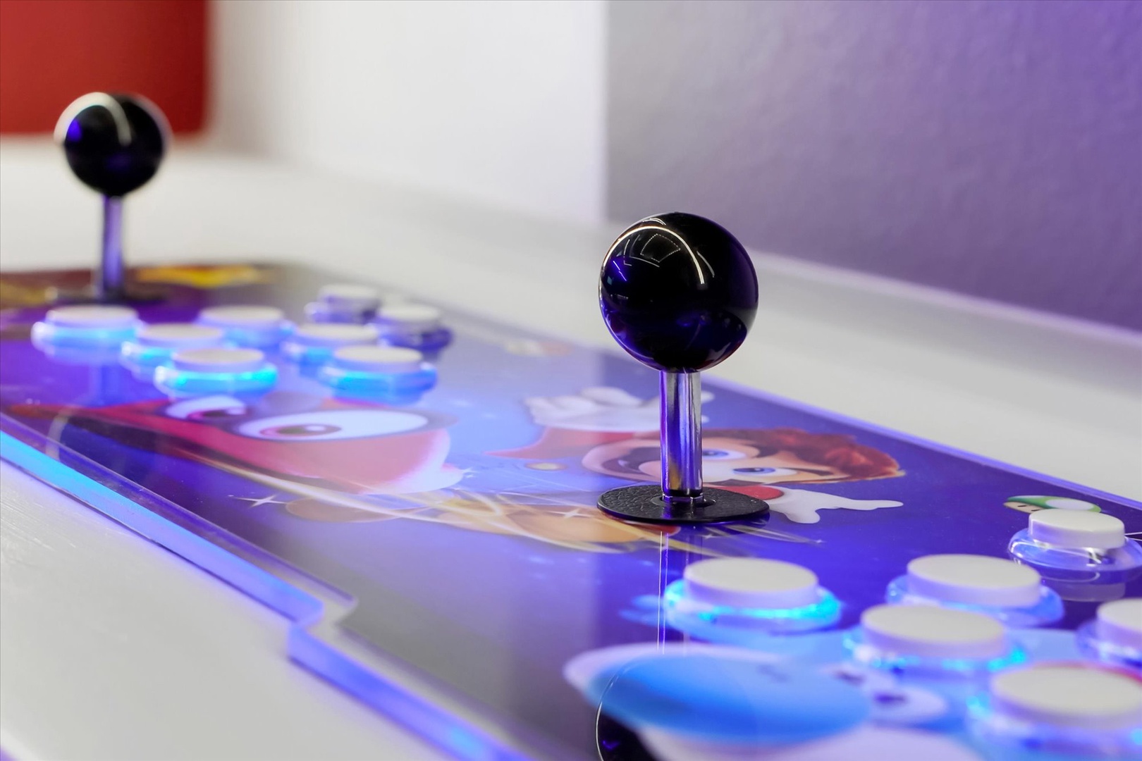 Challenge your friends or unwind solo on this vibrant arcade-style gaming console with glowing controls and classic joystick action.