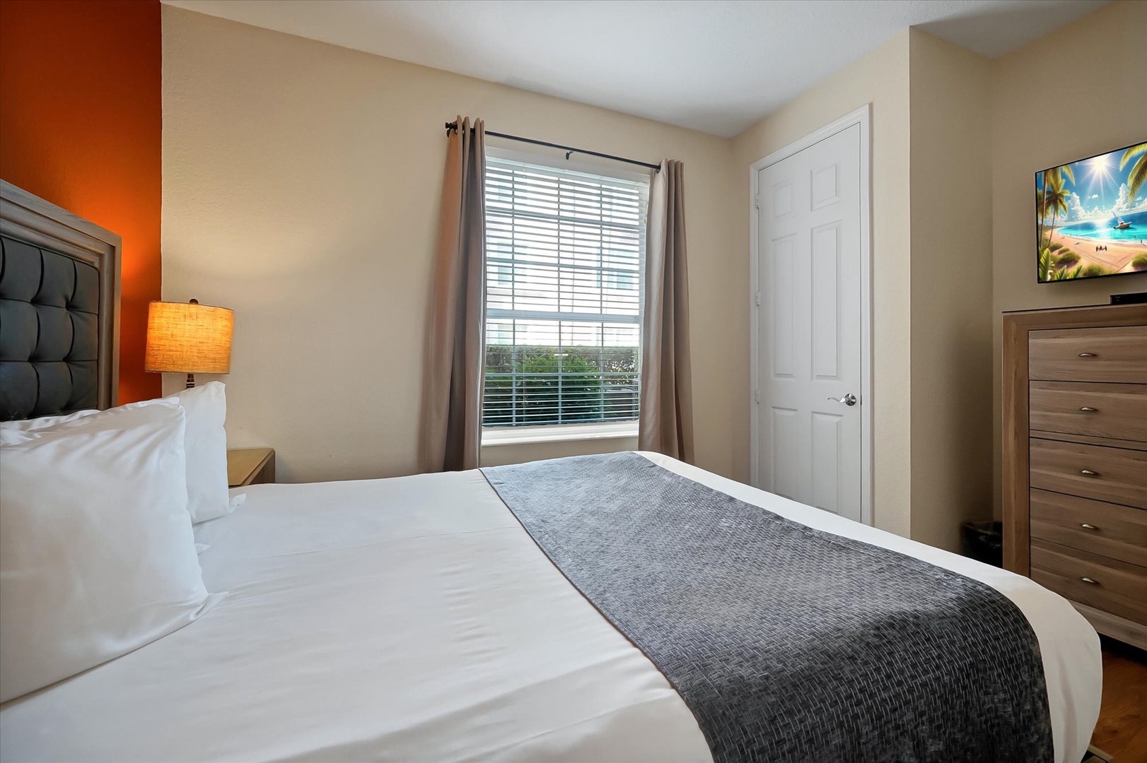 Sink into crisp linens and enjoy peaceful mornings in your bright, comfortable bedroom with natural light streaming through.