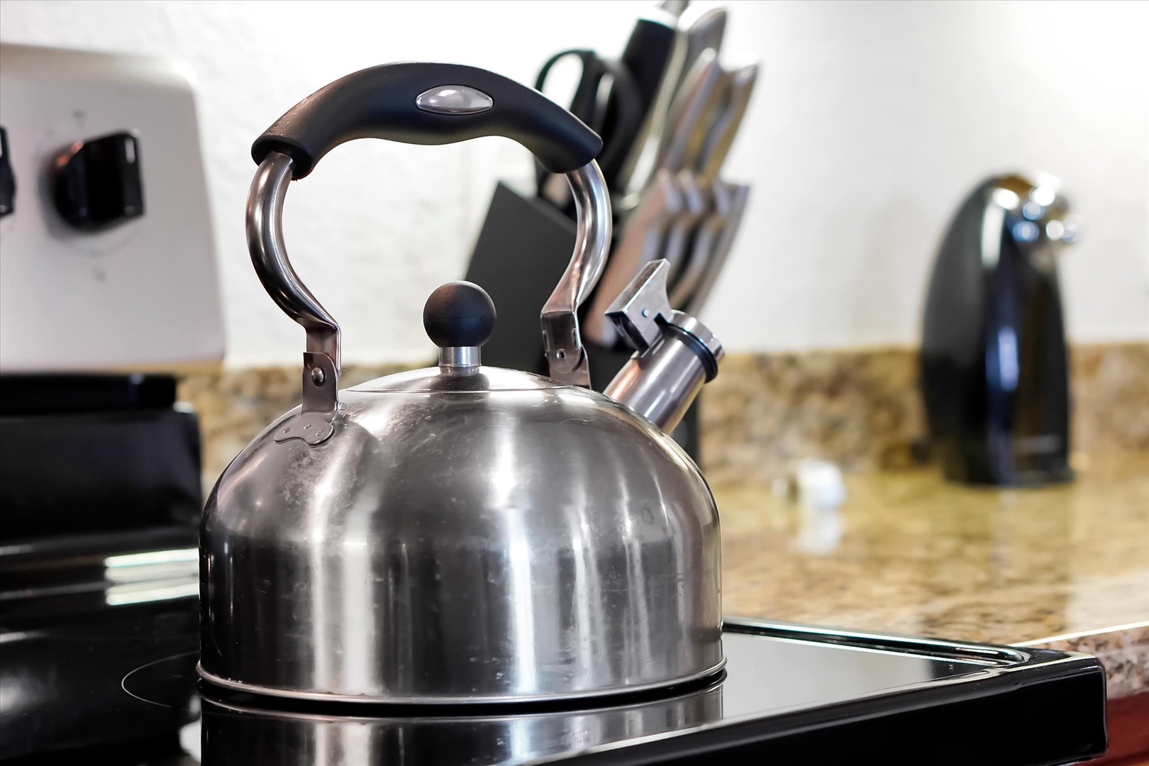 Brew your morning coffee with this sleek stainless steel kettle, perfectly placed in your fully equipped kitchen for convenient meal preparation.