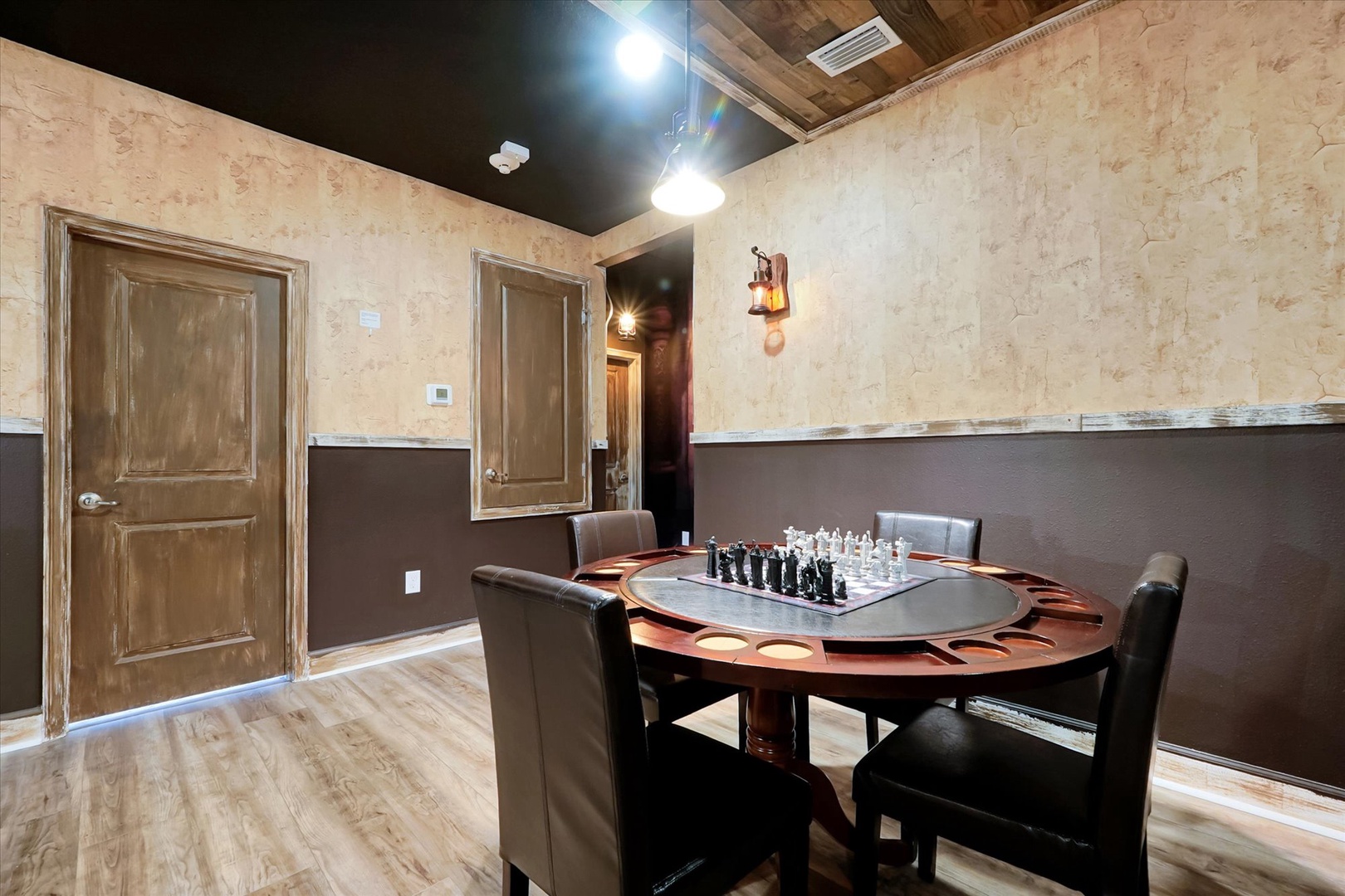 A private game room featuring a custom poker and chess table, perfect for friendly competition and entertainment during your stay.