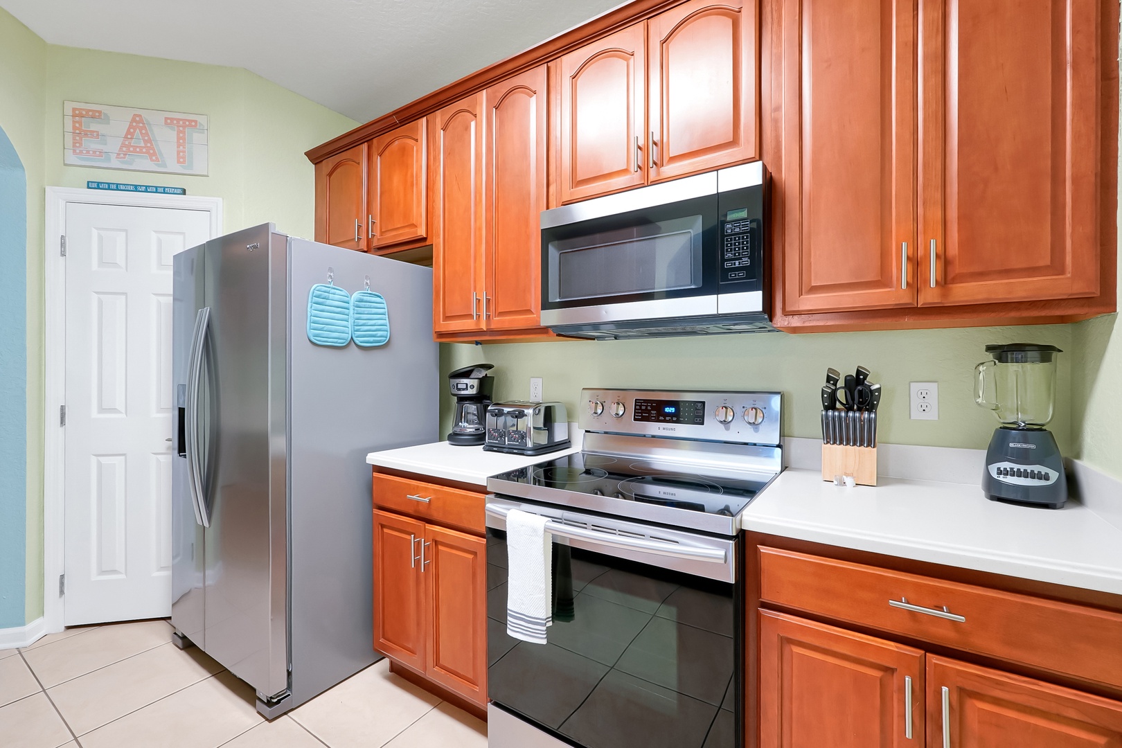 You'll love cooking in this fully equipped kitchen with rich wood cabinets, stainless steel appliances, and everything needed for memorable meals.