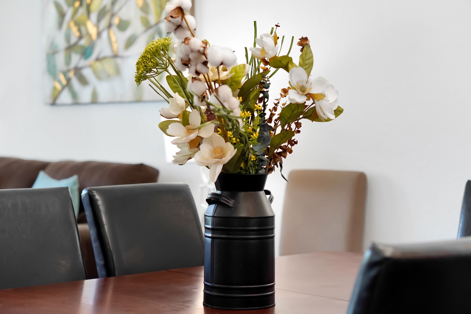 Fresh flowers grace your dining table, creating a warm welcome as you settle in for memorable meals together.