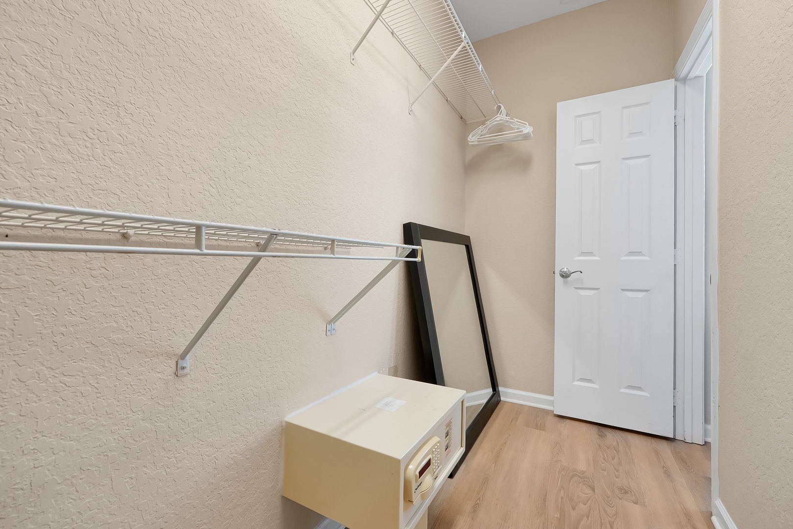 Your spacious walk-in closet offers ample hanging space and storage for all your belongings during your stay.
