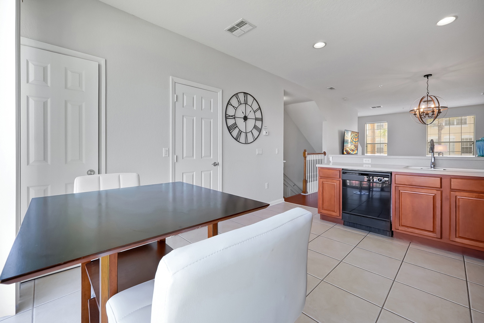 Your open kitchen flows into the dining area, where modern appliances and warm wood tones create the perfect space for memorable meals together.