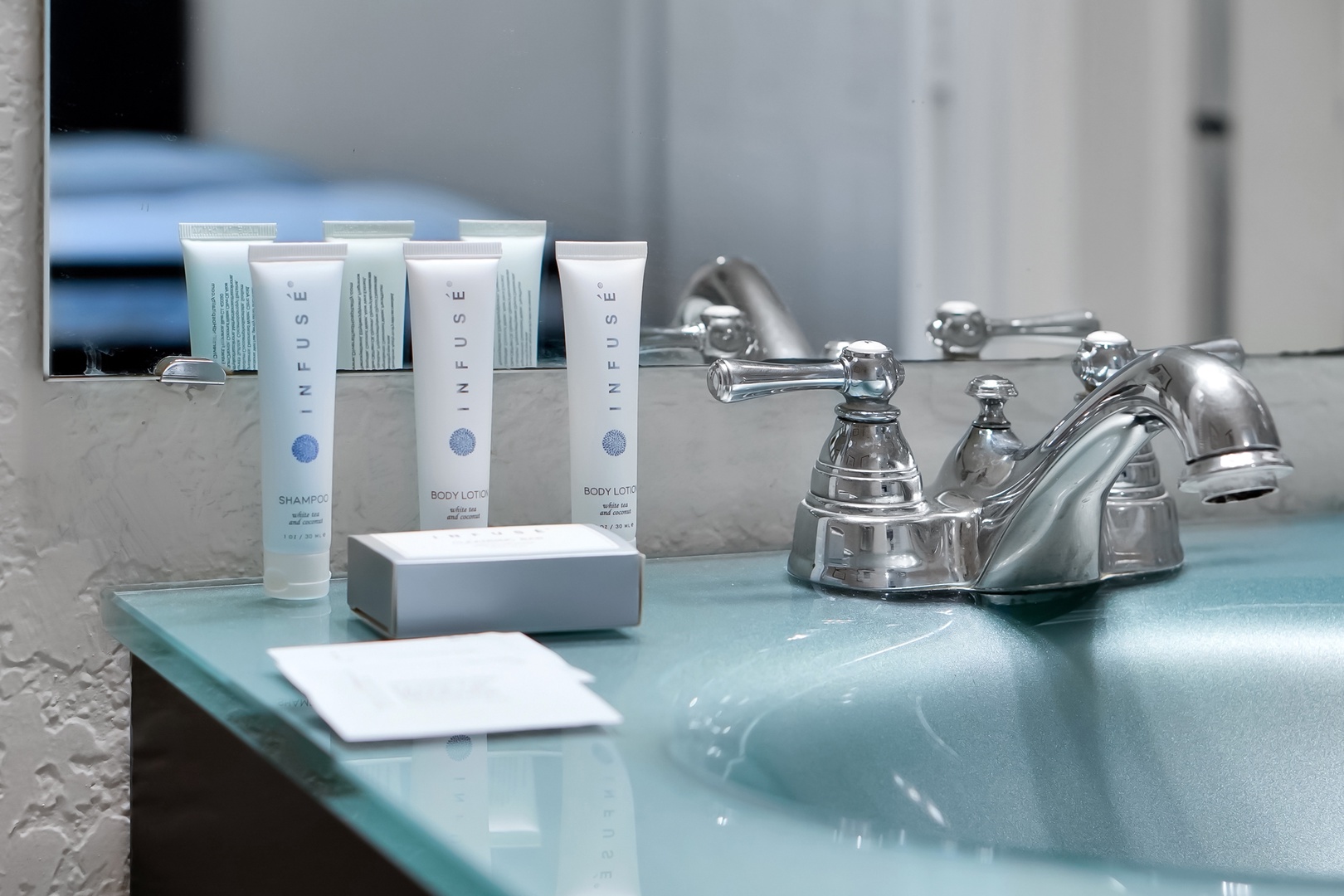 Indulge in premium spa amenities thoughtfully arranged at your sink, with luxury toiletries ready to pamper you after a day of adventure.