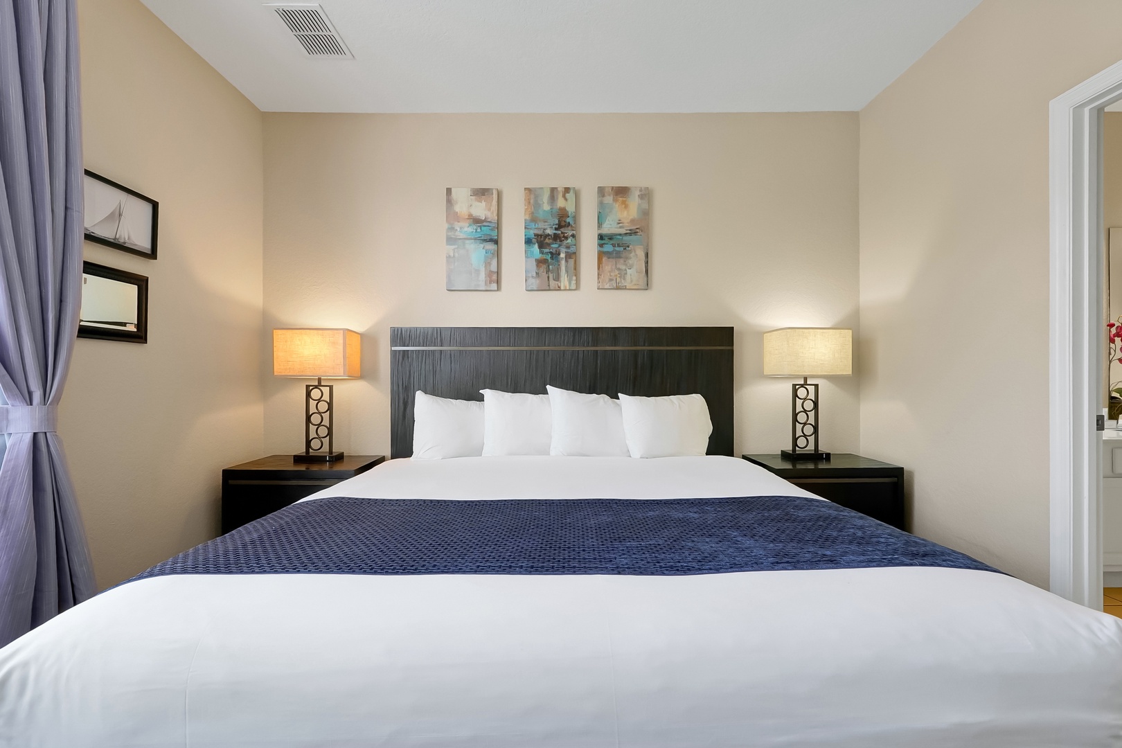 Sink into crisp white linens and plush pillows for the perfect night's rest in your elegantly appointed bedroom retreat.