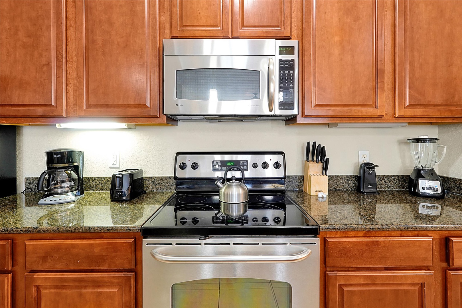 Your fully equipped kitchen awaits with granite countertops, stainless steel appliances, and everything you need to prepare delicious meals during your stay.