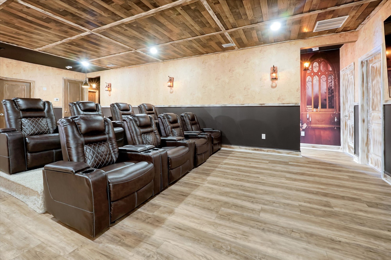 Settle into plush recliners in your private theater room, where reclaimed wood ceilings and ambient lighting create the perfect atmosphere for movie nights with loved ones.
