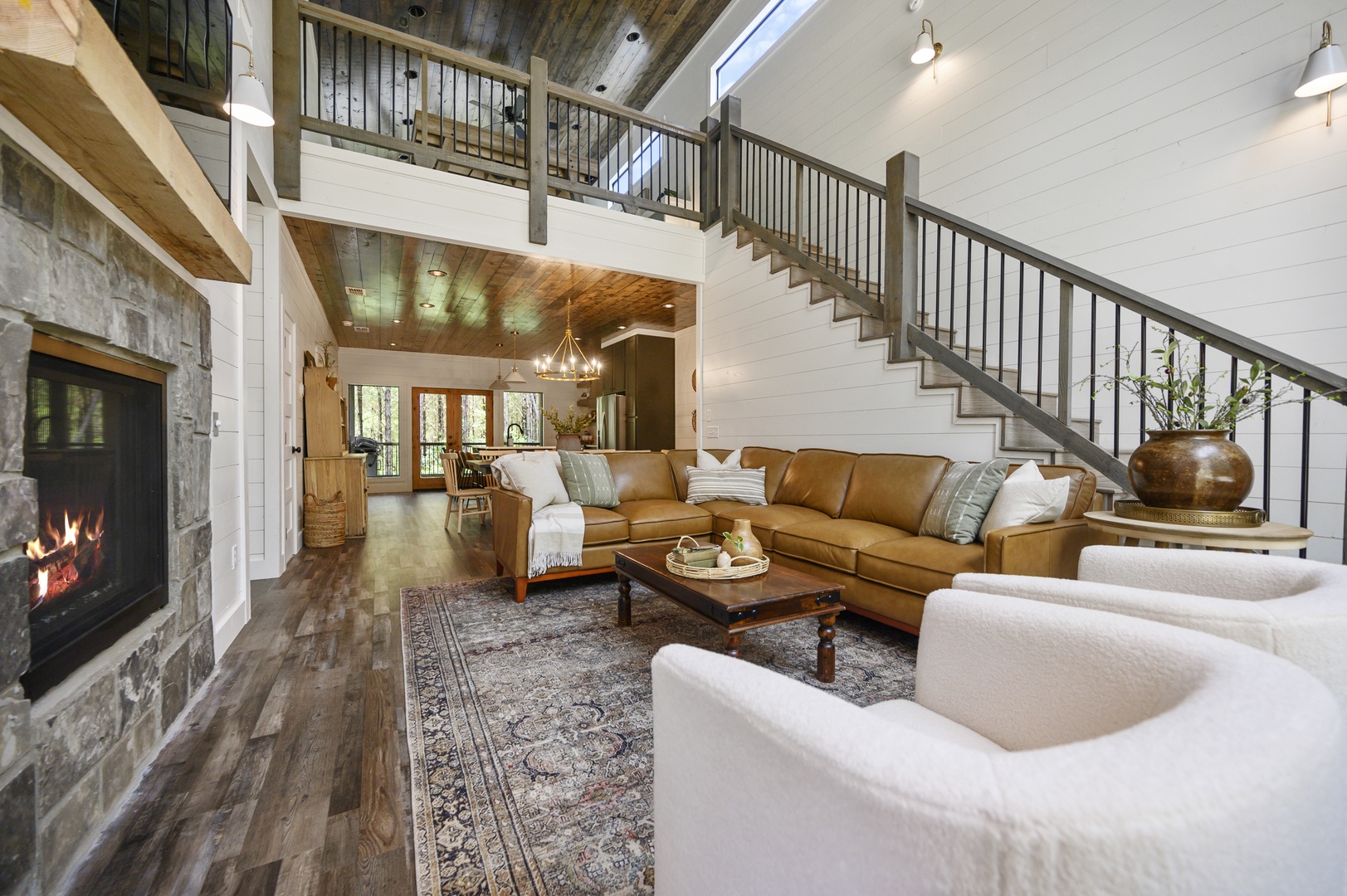 Spacious living room opens to upstairs loft space