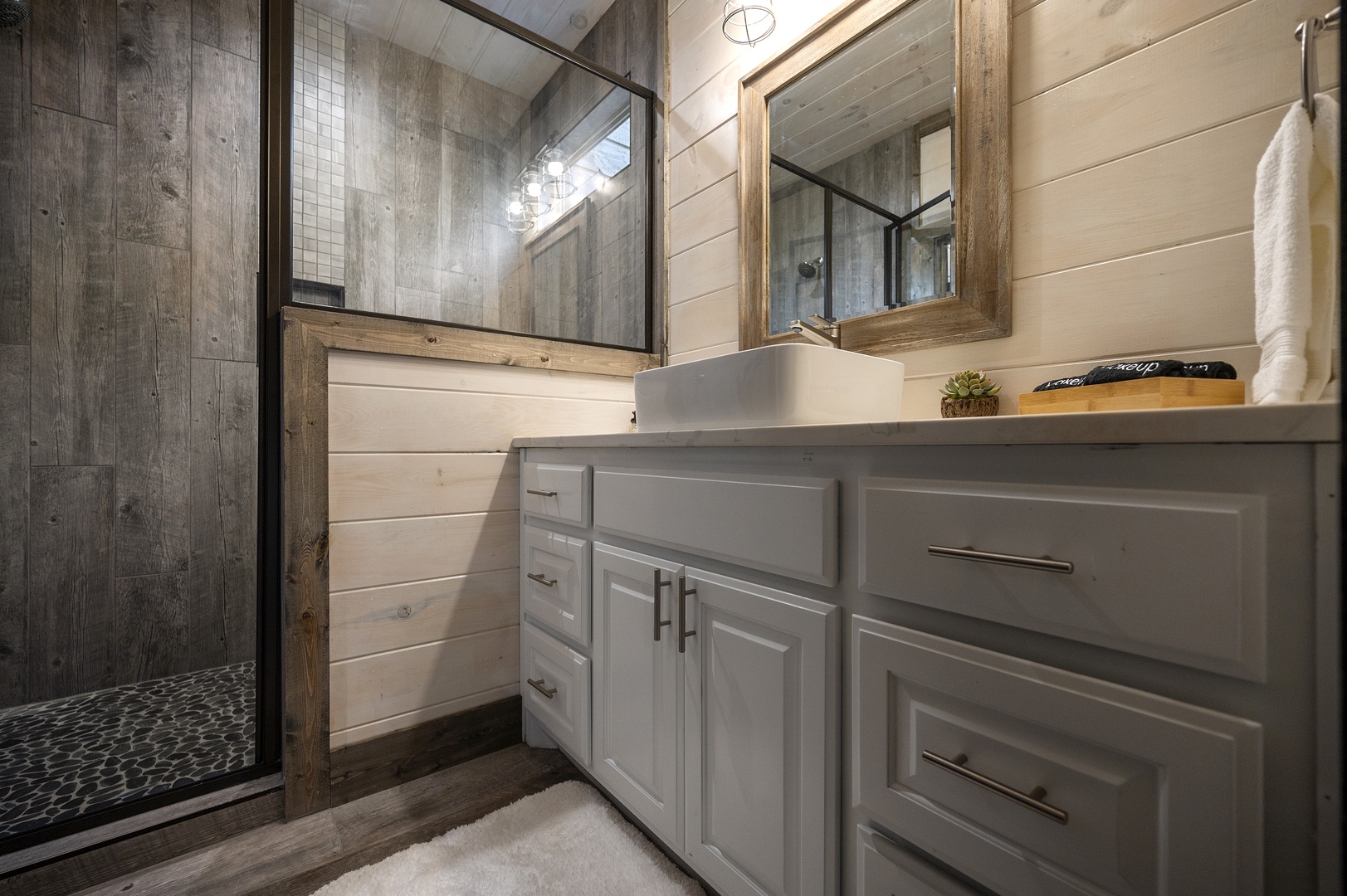Full ensuite bathroom for boys' bunk room with walk-in shower