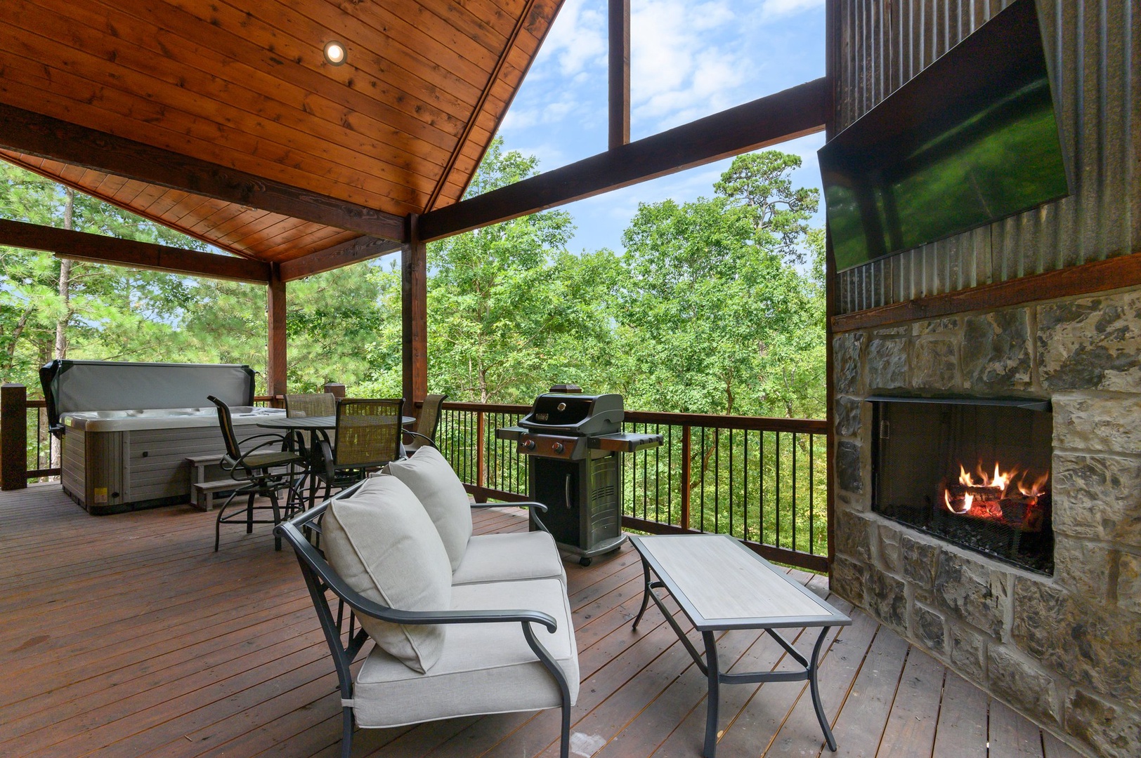 Back deck provides seating, dining, and relaxing space