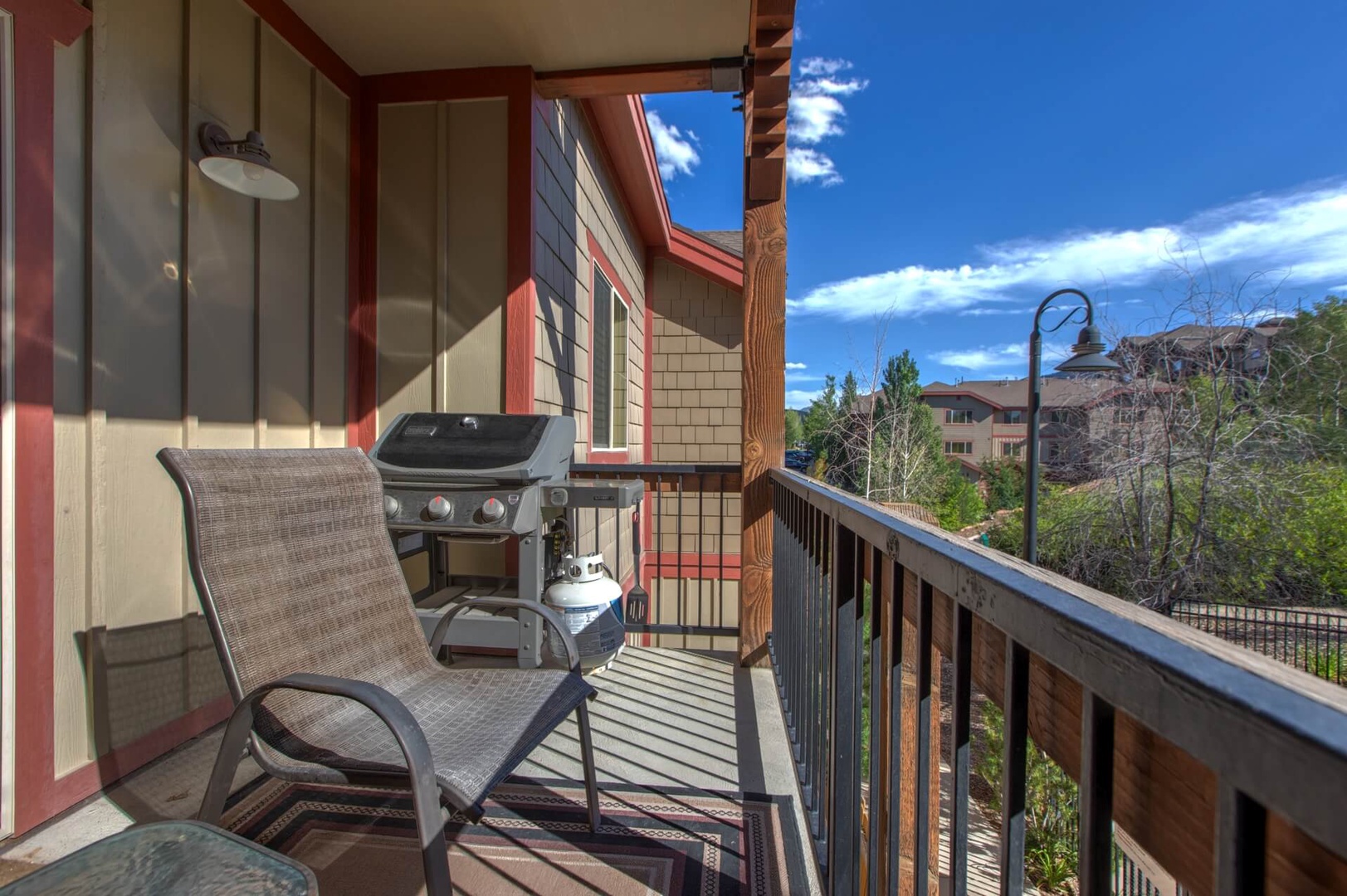 Bear Hollow Lodges 1304: The large outdoor balcony with seating and gas grill, accessed through the living room, opens to glorious views and fresh air of the beautiful mountains.