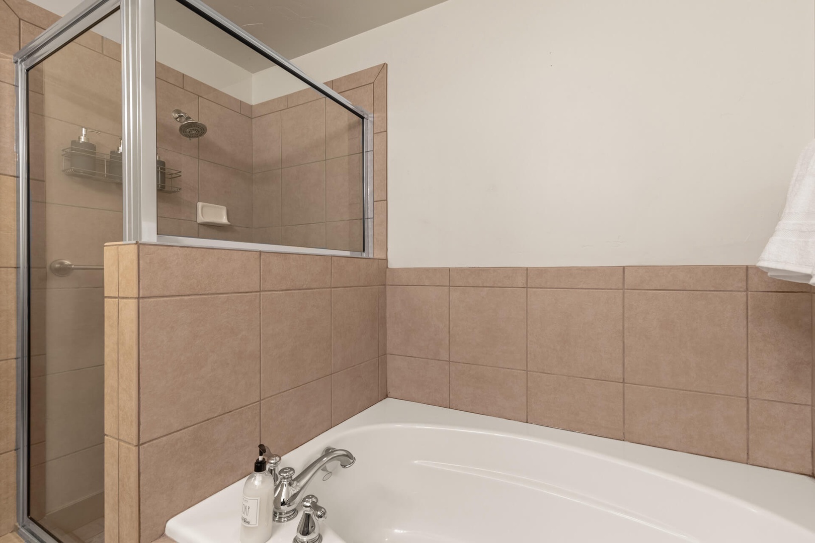Bear Hollow Lodges 1313:   The primary bedroom bath has a luxurious step-in shower, and large soaking tub.