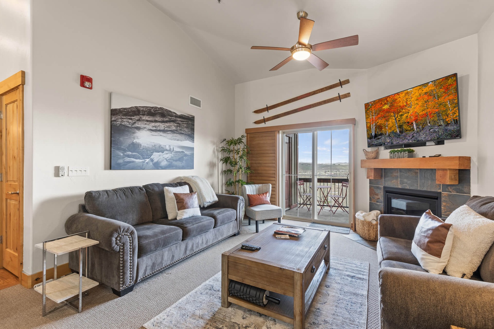 Bear Hollow Lodges 1313:  Take a seat on the plush leather sofa or loveseat, and enjoy a movie or your favorite TV show on the large HDTV.   From the great room, a sliding glass door frames the mountain views and allows access to the private patio area.