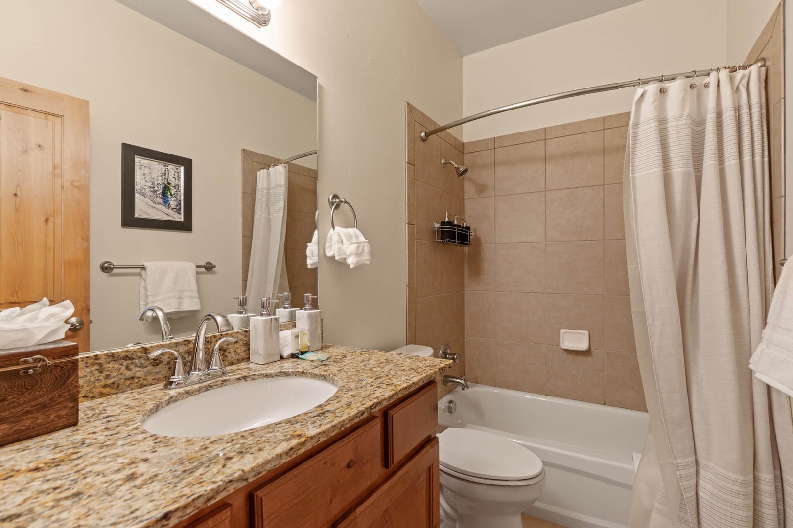 Bear Hollow Lodges 1313:  A second shared large full bathroom space with a sink and tub / shower combo is conveniently located is just across the hall from from the bedrooms.