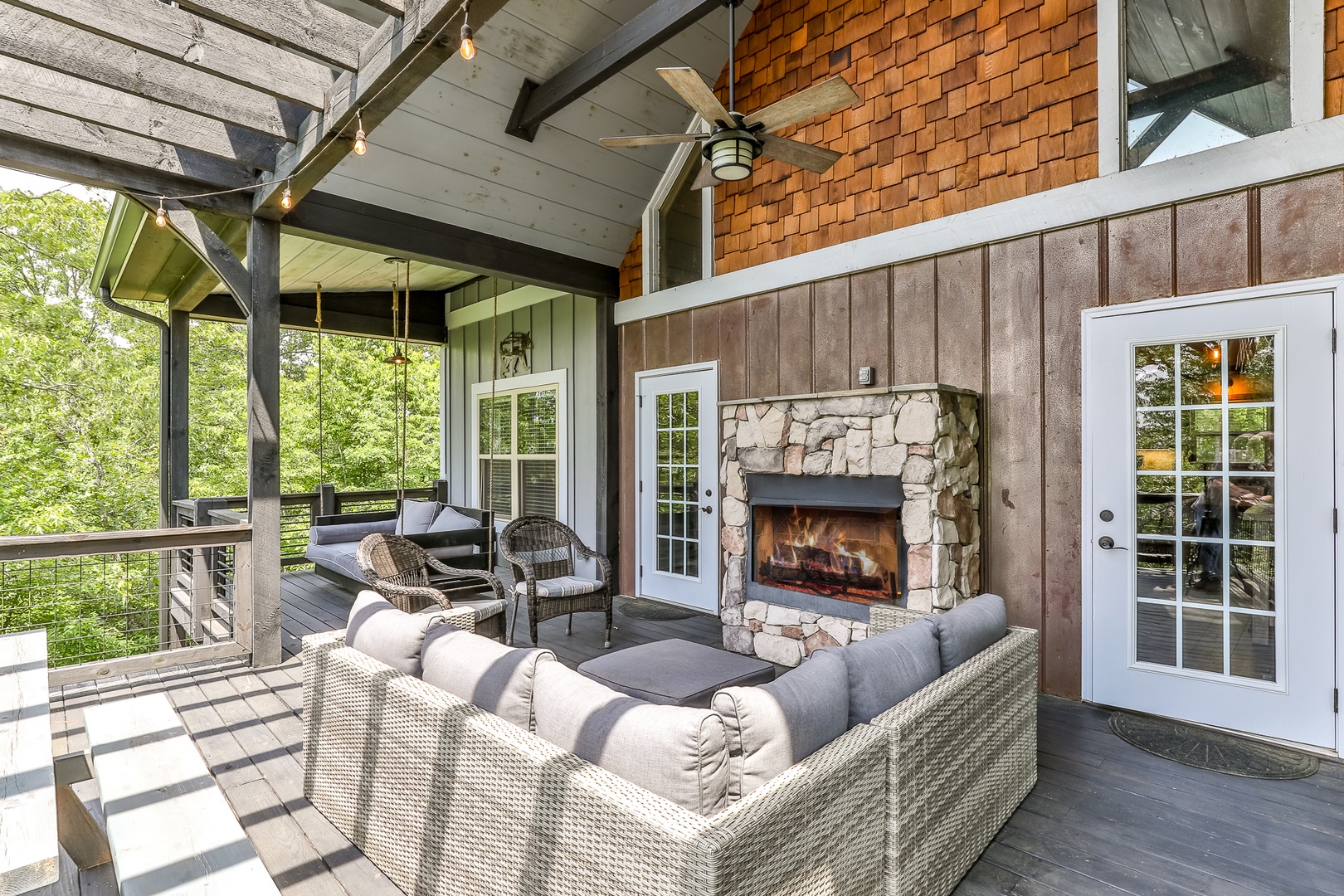 Spacious but cozy back porch with gas fireplace (avail during season)