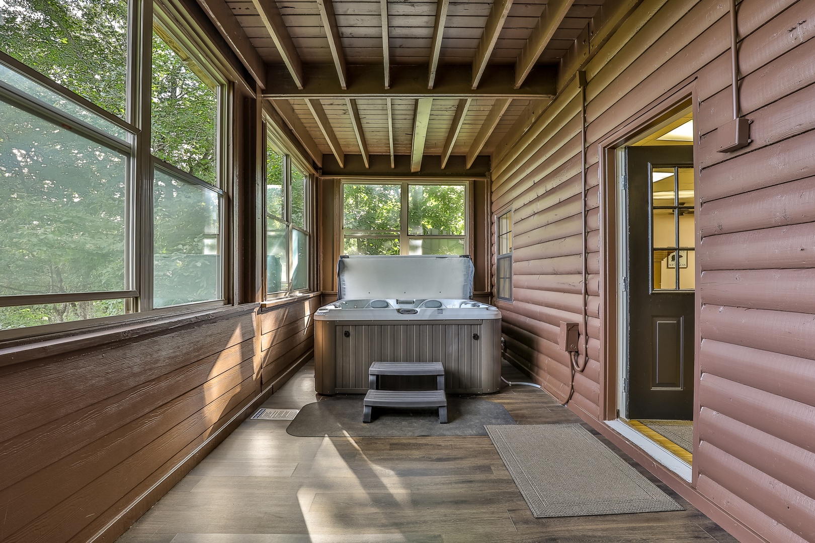 large hot tub on lower sun porch