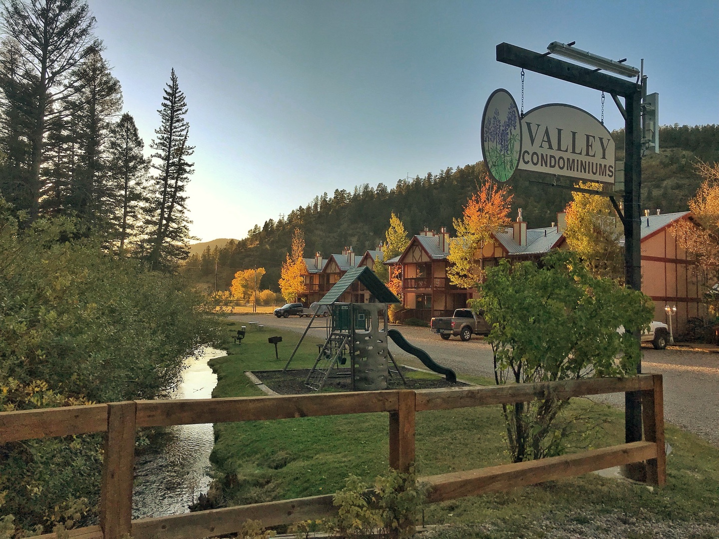 Condos and creek in fall