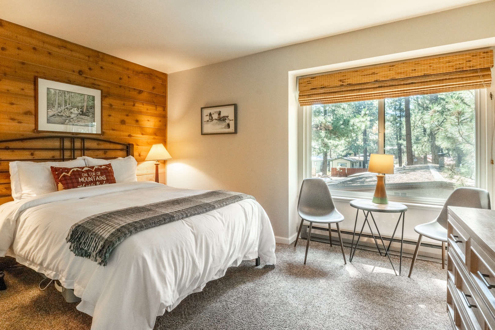 Nomadness Rentals Listing #637 in Mammoth Lakes California, warm and cozy bedroom with view of woods in the background