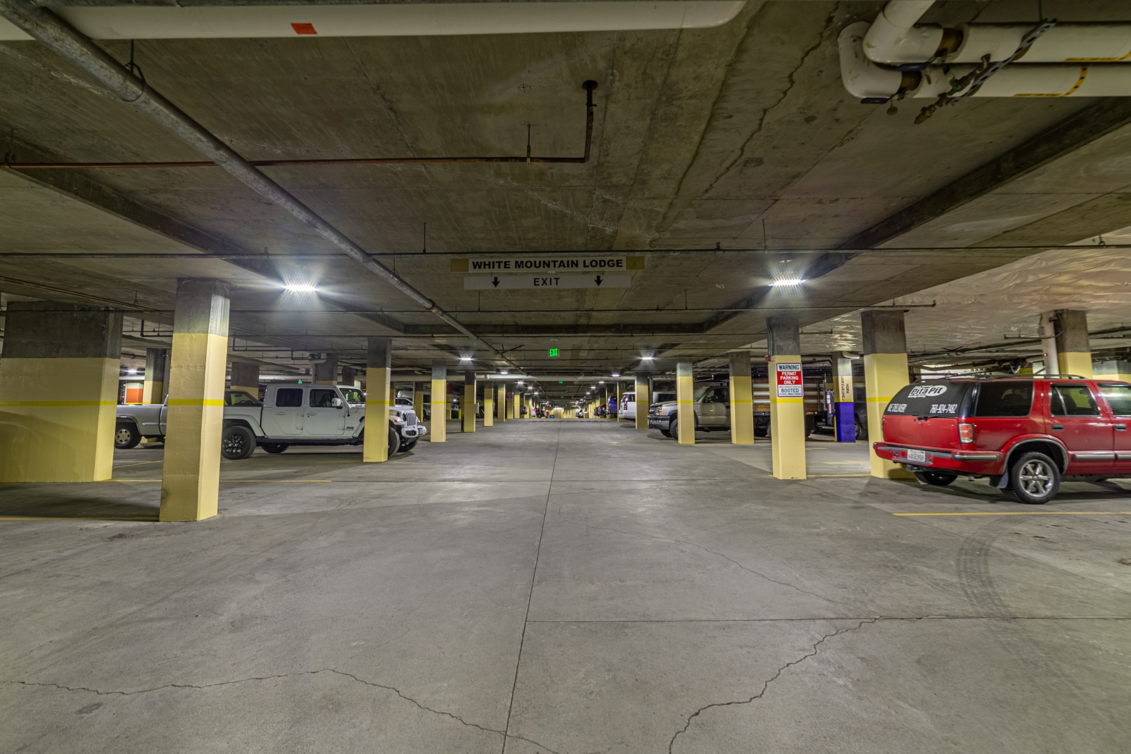 Parking pillars yellow & labeled "W" for White Mountain guests!