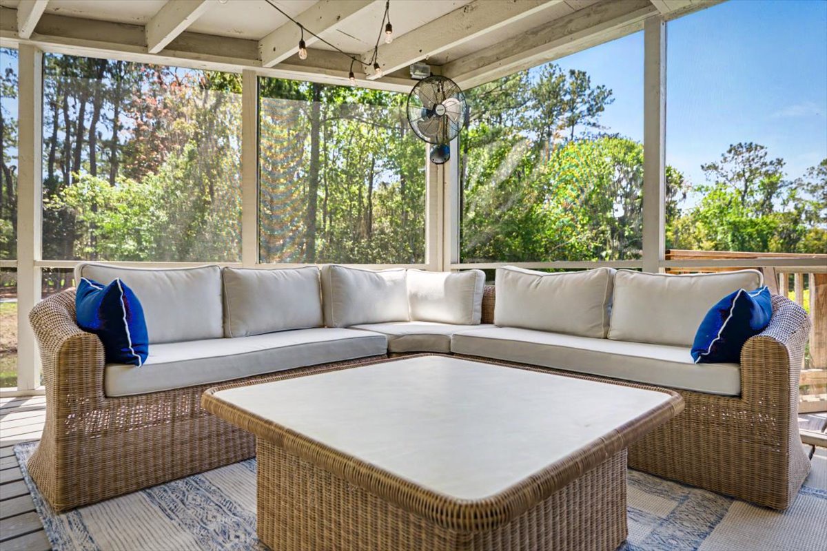 Settle into your private screened porch where plush wicker seating and forest views create the perfect retreat for morning coffee or evening relaxation.