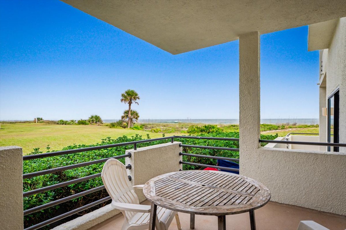 Step onto your private balcony where morning coffee tastes better with panoramic views of lush palm trees and endless open landscape stretching to the horizon.