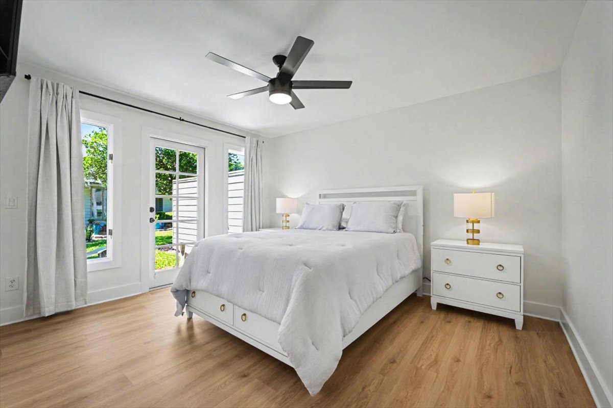 Your peaceful bedroom features soft linens and French doors that open to your private outdoor space.