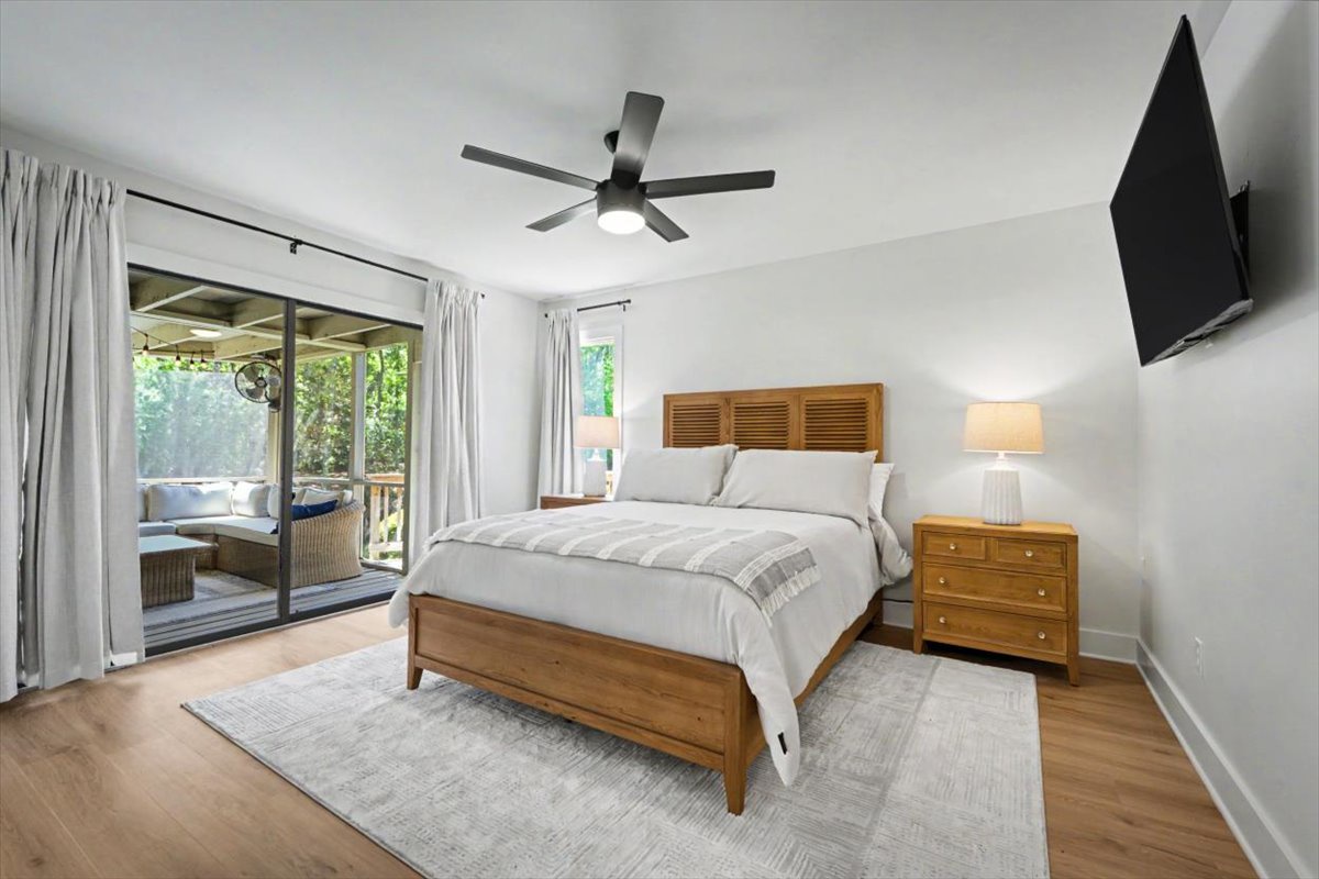 Drift off peacefully in your master bedroom where warm wood tones meet crisp linens, while sliding doors open to your private outdoor oasis.