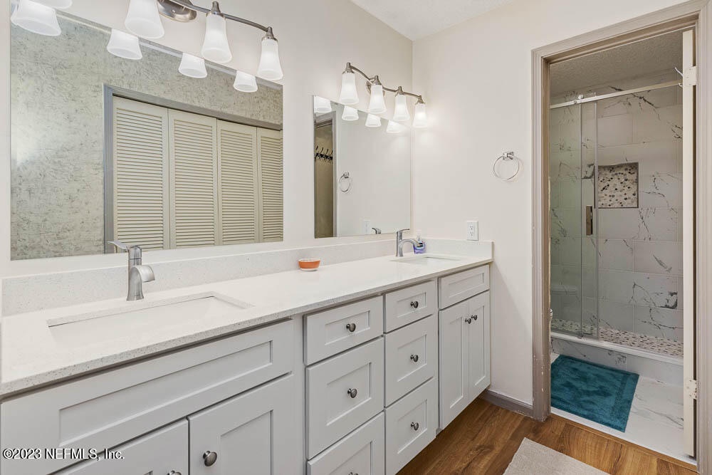 Unwind in your spa-like bathroom with dual vanities, elegant marble accents, and a spacious walk-in shower designed for your comfort.