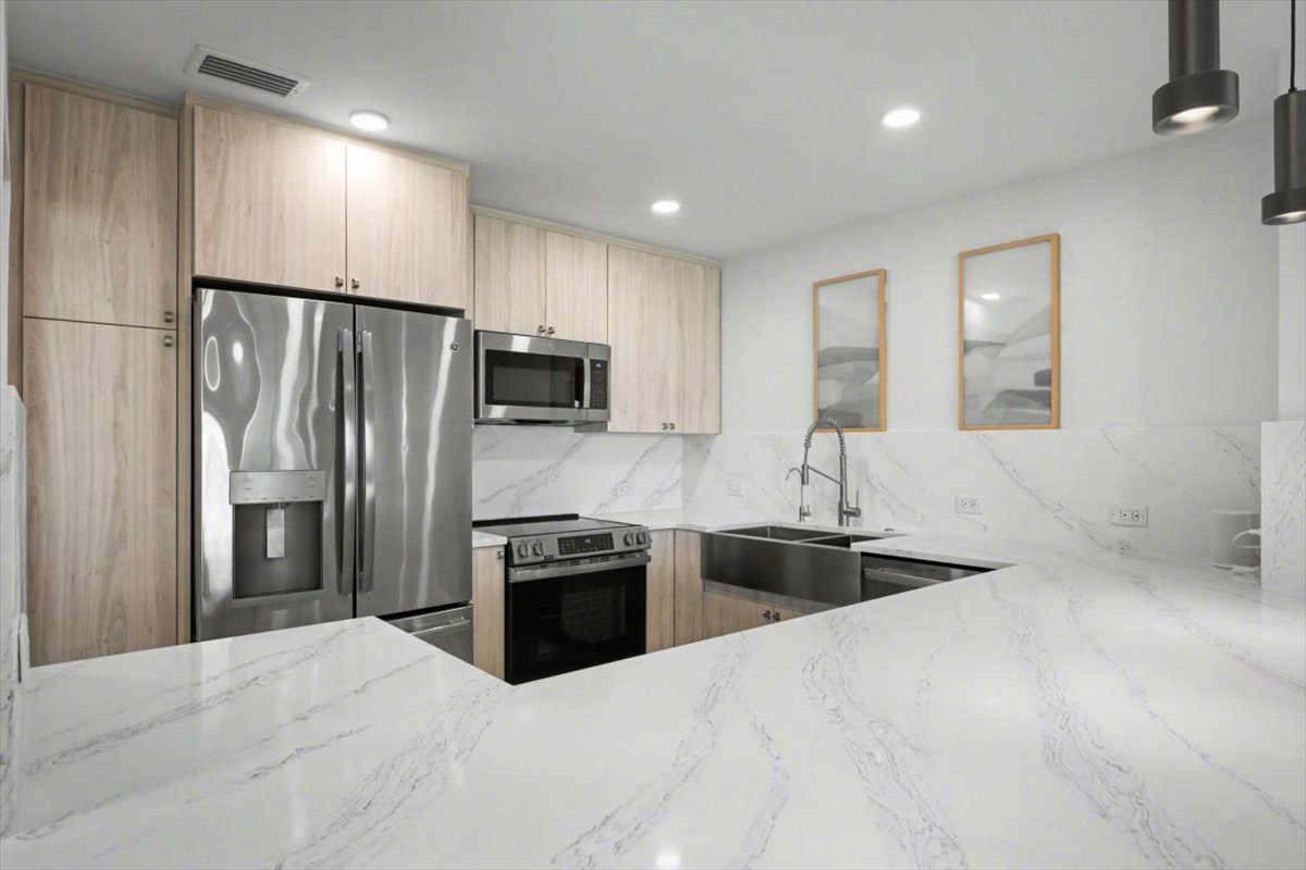 Your modern kitchen features sleek marble countertops, stainless steel appliances, and ample storage for effortless meal preparation.