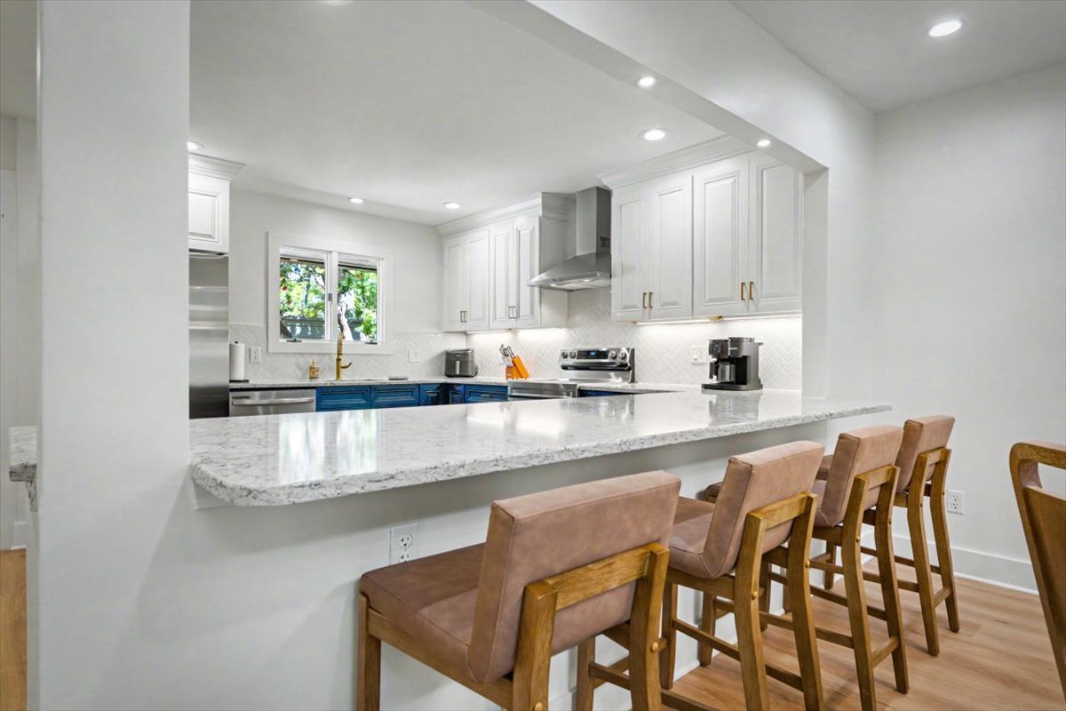 Your gourmet kitchen awaits with gleaming granite counters and premium appliances for memorable meal prep together.