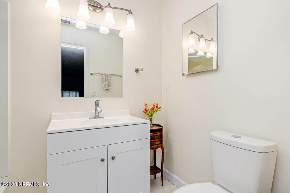Step into this bright, freshly updated bathroom where modern touches meet classic comfort. Soft lighting highlights the crisp white vanity and walls, creating a serene space for unwinding after your adventures.
