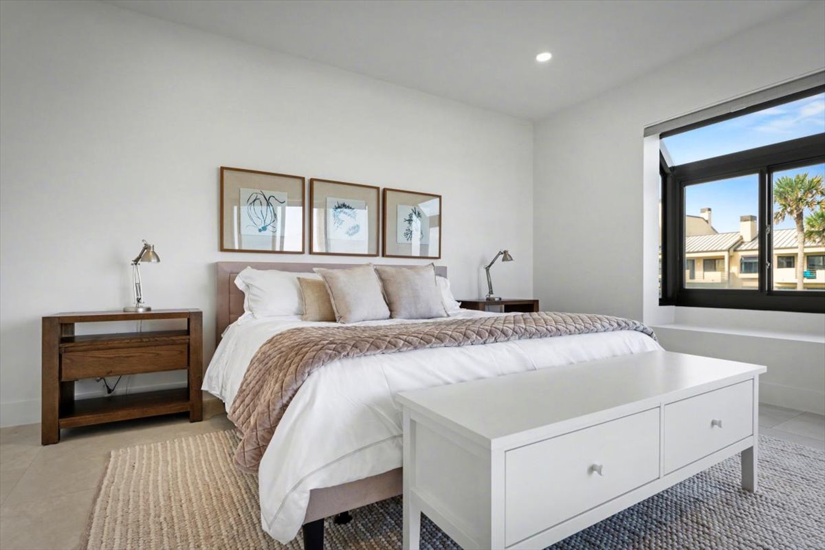 Unwind in your serene bedroom sanctuary with crisp linens, calming artwork, and warm natural light creating the perfect retreat.