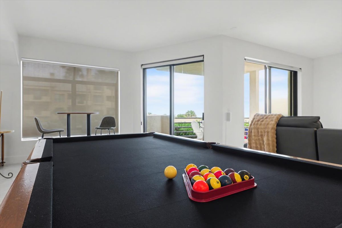Challenge your companions to pool games while enjoying natural light streaming through the windows in this spacious entertainment area.