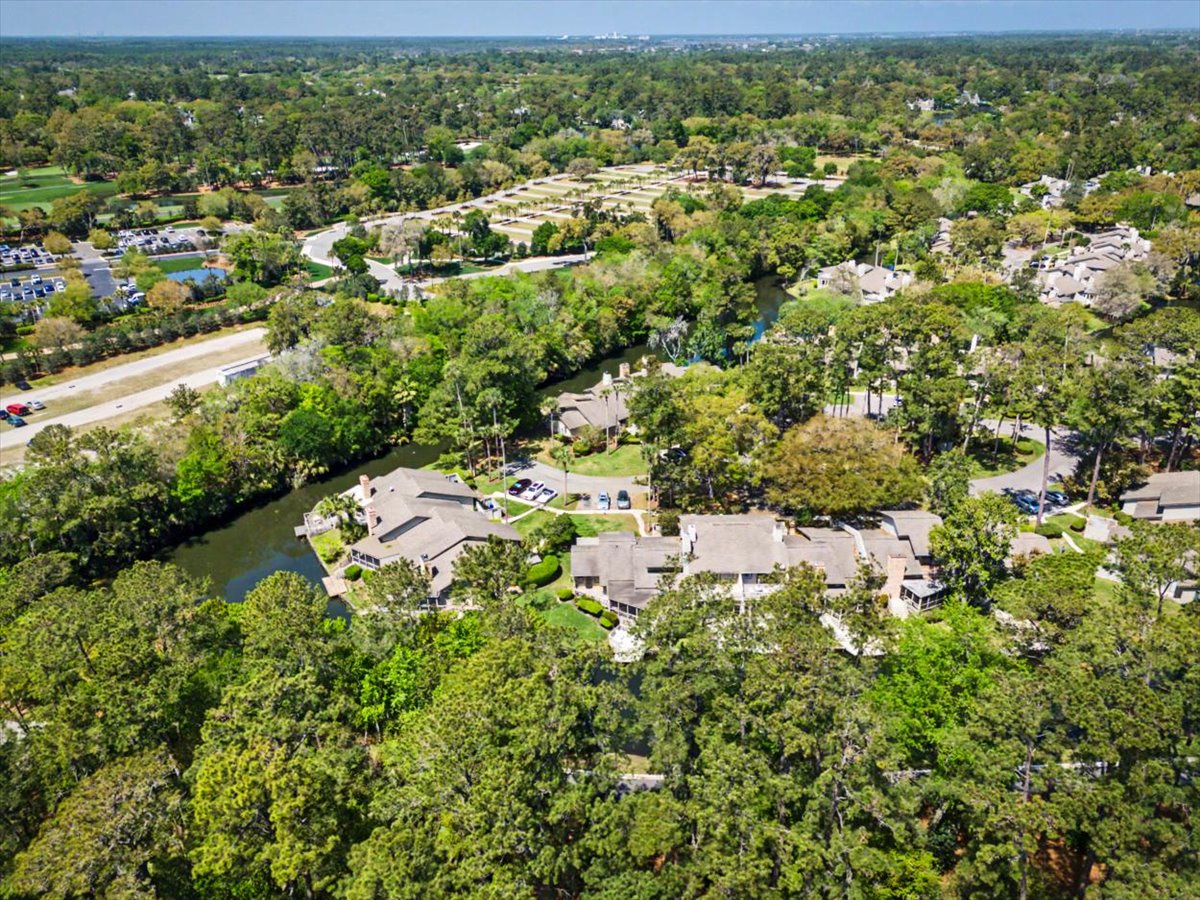 Nestled among lush trees in a quiet residential area, this property offers peaceful surroundings with natural beauty.