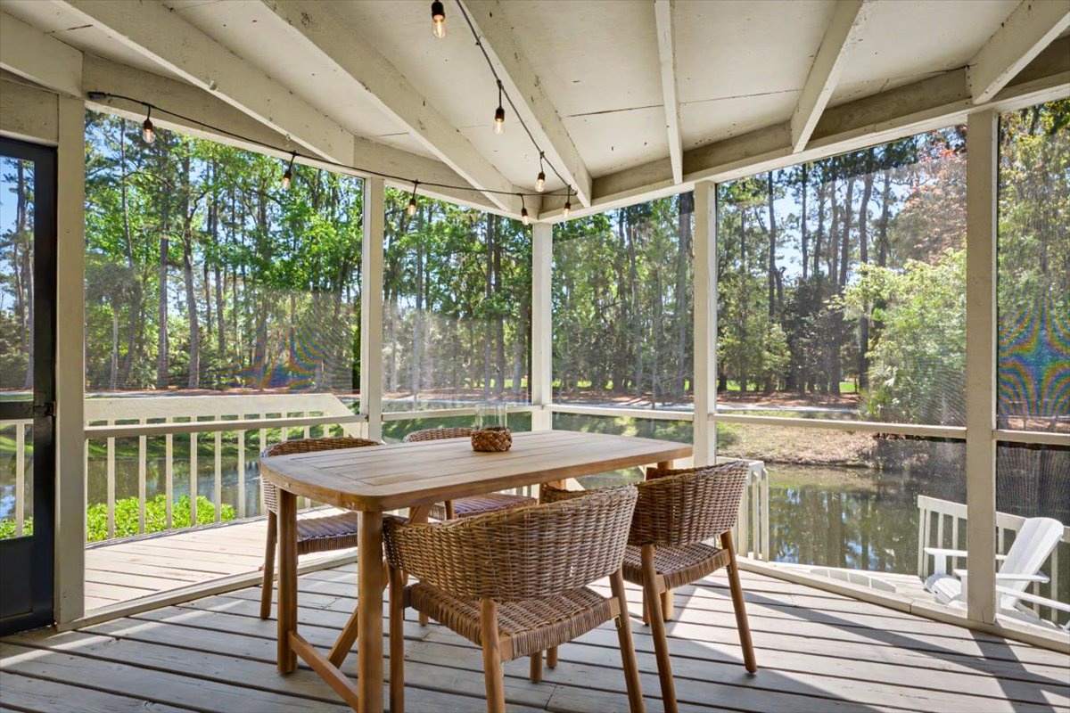 Your screened porch offers peaceful forest dining where morning coffee and evening meals feel naturally serene.