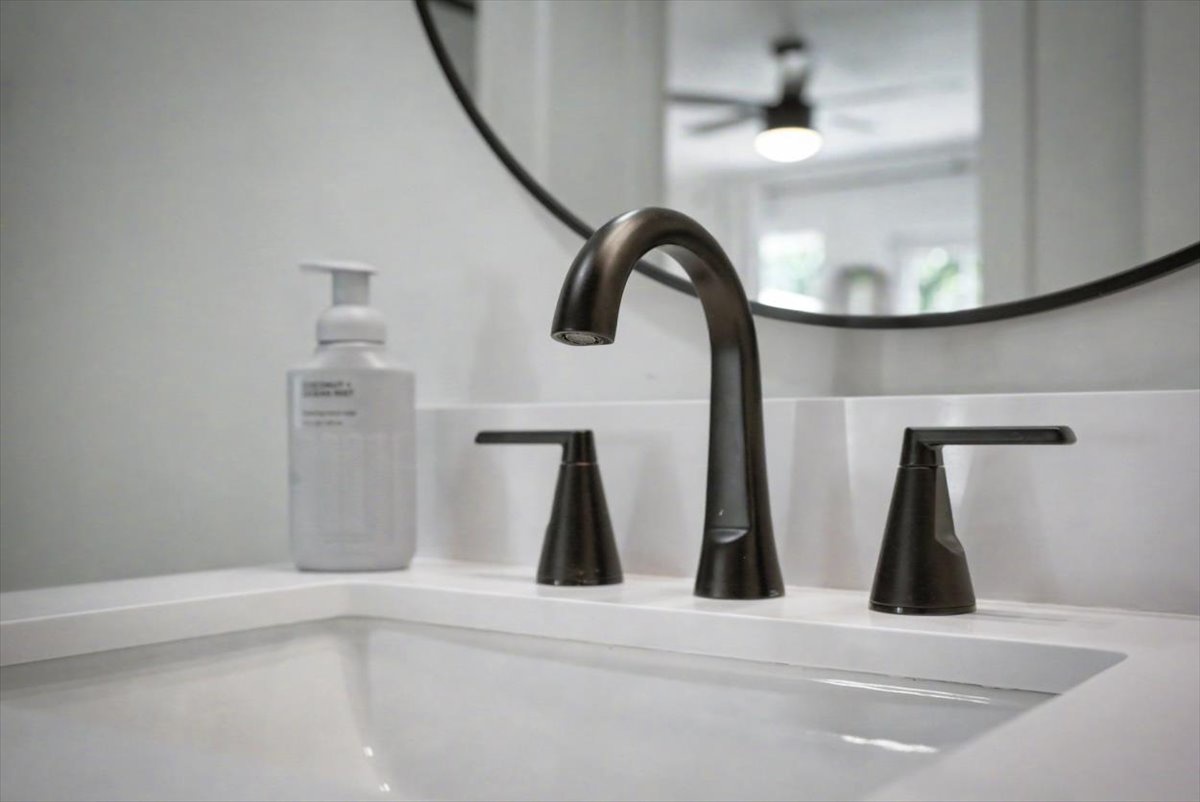 Refresh in your pristine bathroom featuring sleek modern fixtures and premium amenities for your comfort.