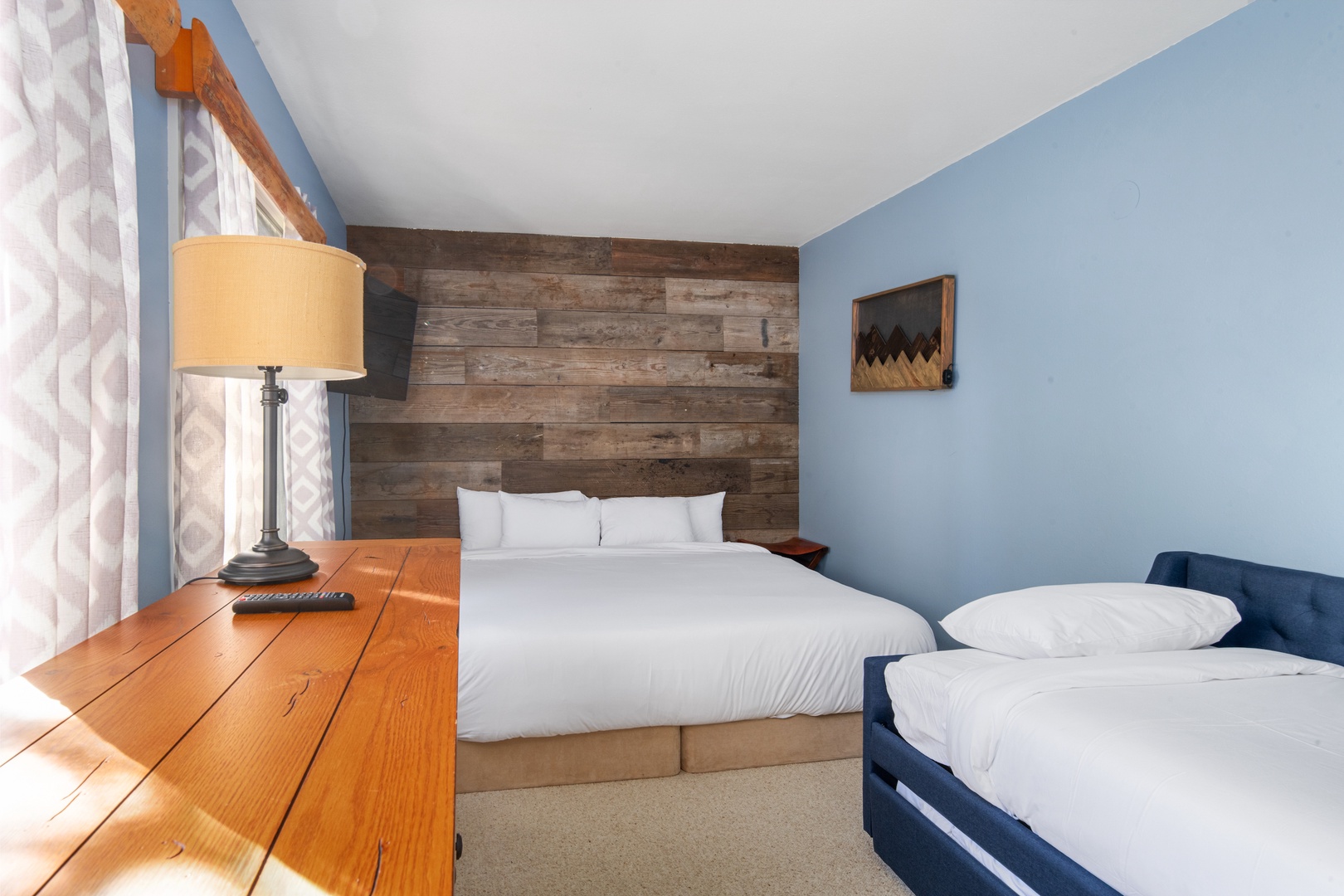 Guest bedroom with king bed. The twin trundle bed has been removed from the property.