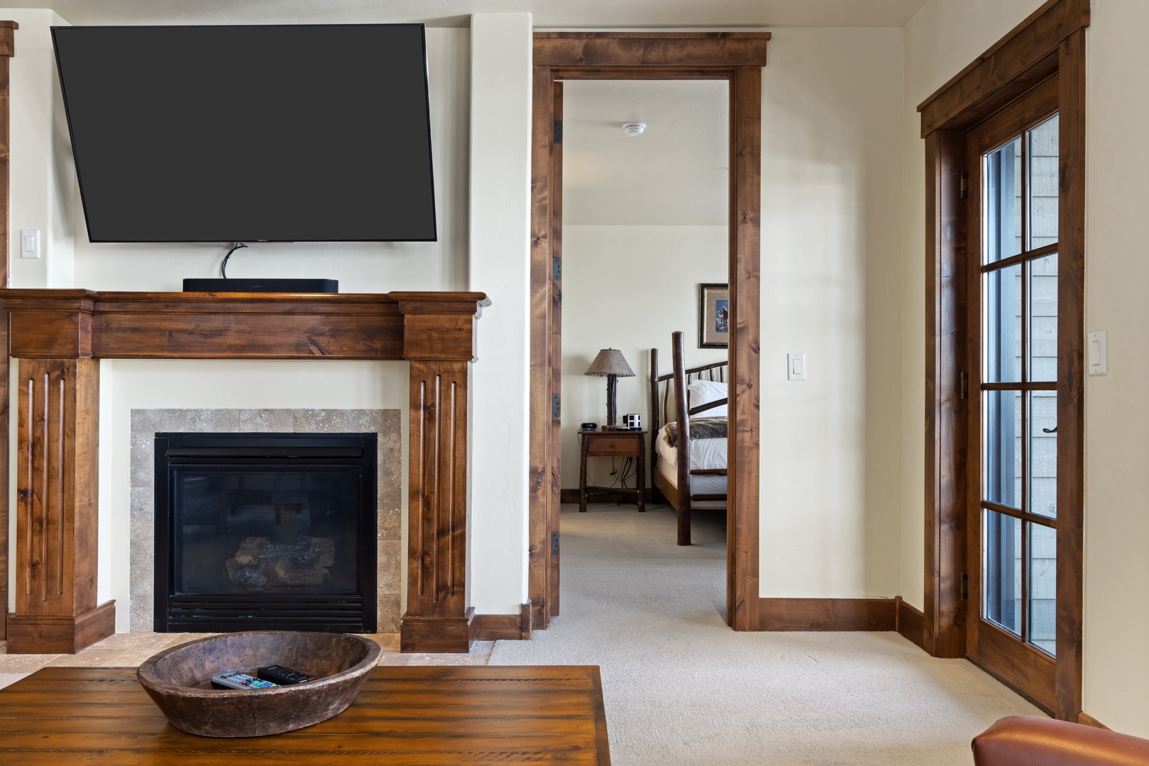 Living Room with Gas Fireplace looking into Primary Bedroom