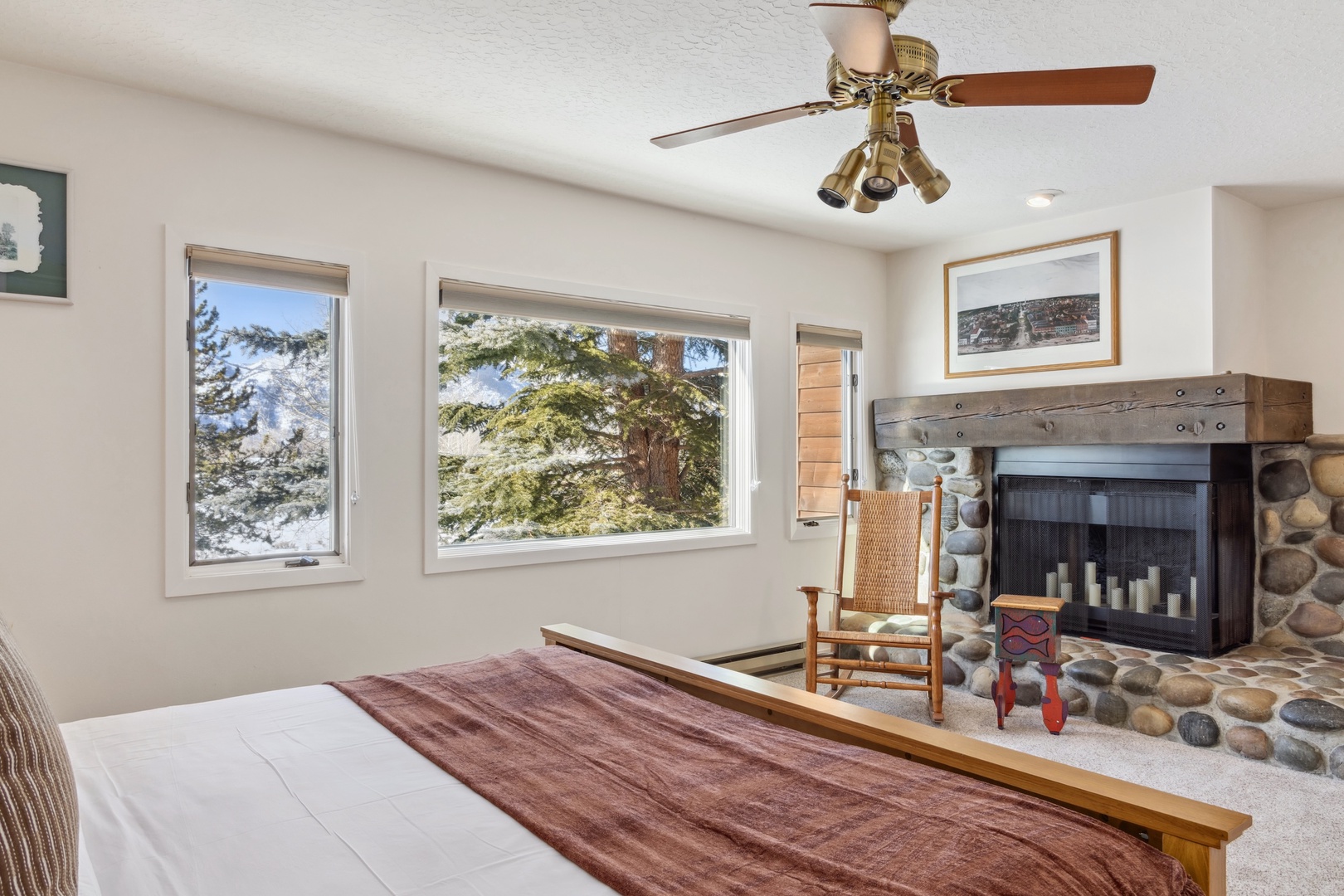 Primary Bedroom - Please note that the fireplace is not for guest use.