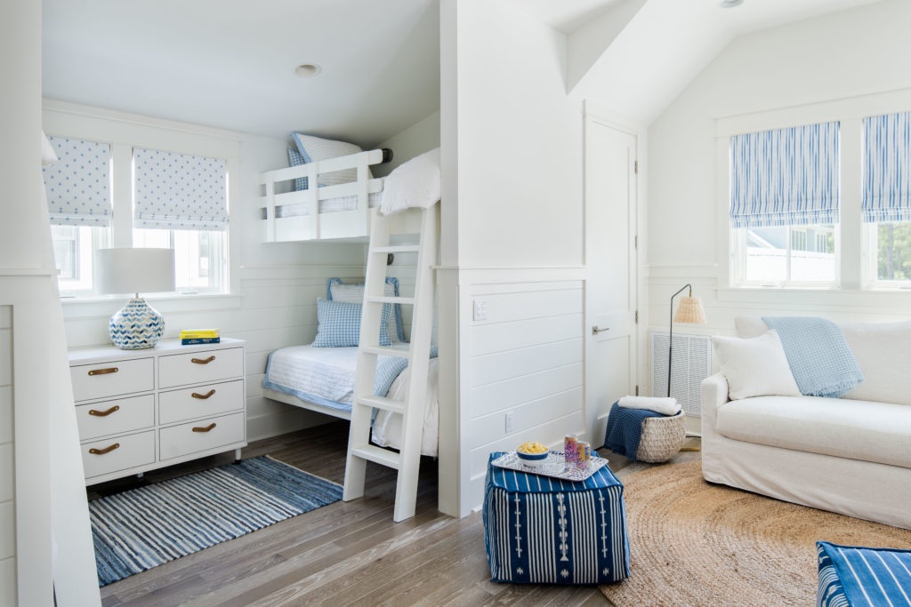 Bunk room off upstairs living area. Barn doors separate living area from bunk room.