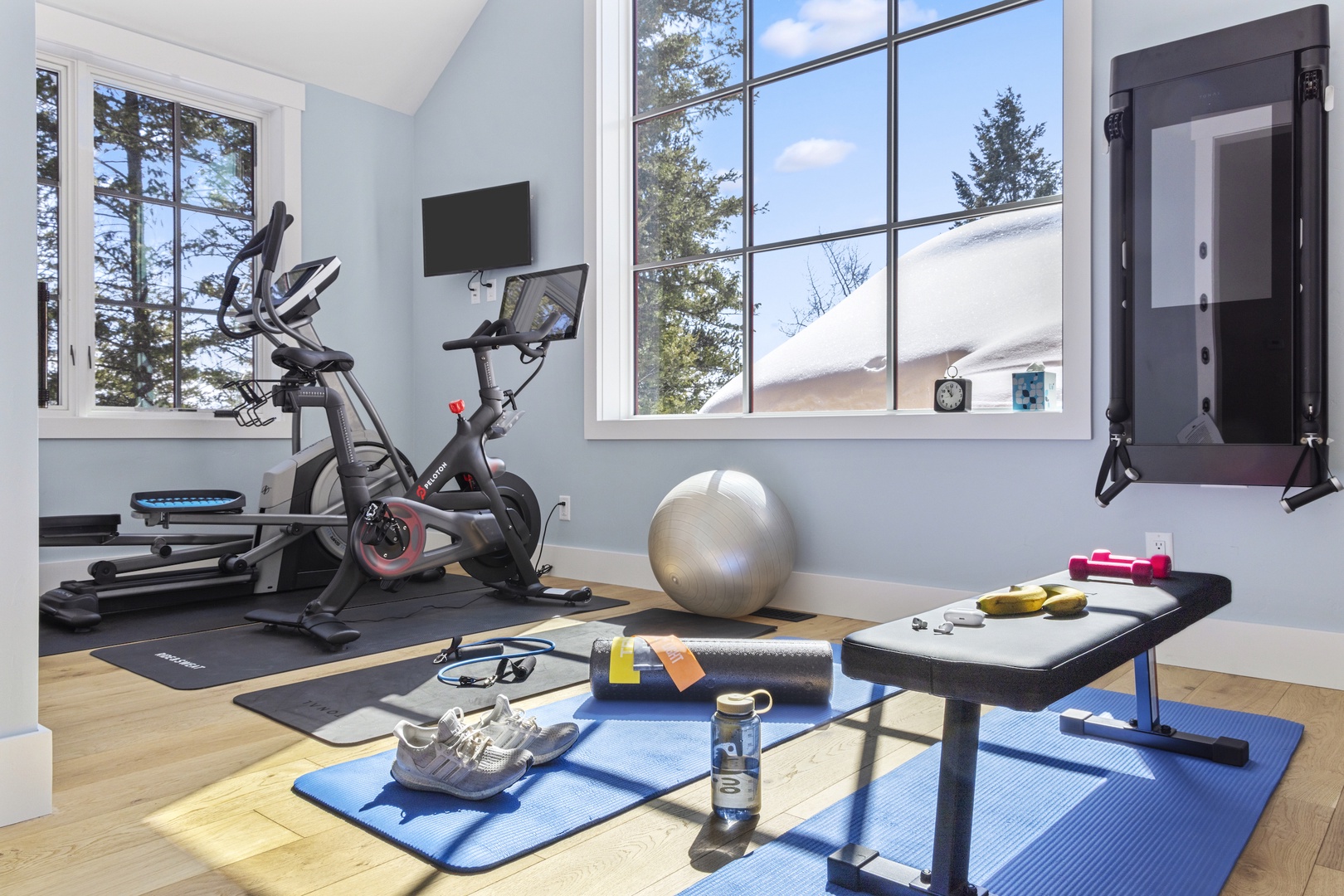 Home Gym with Peloton bike, elliptical, and Tonal