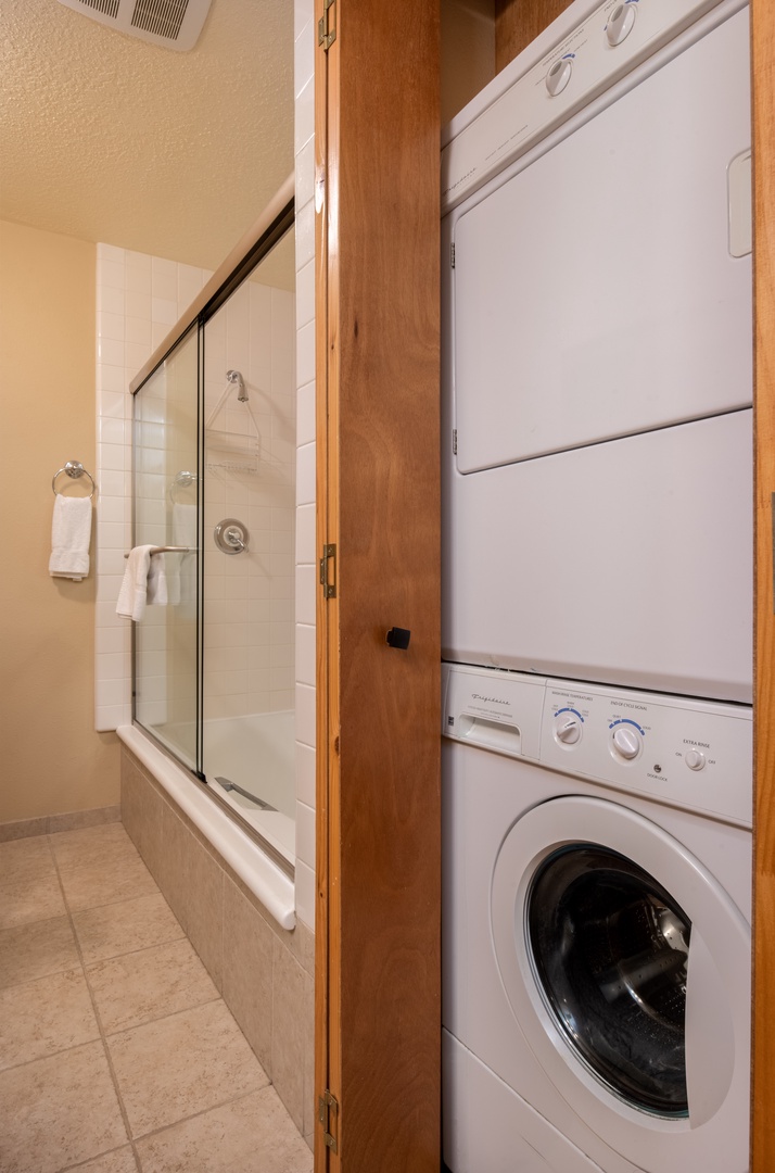 Primary bathroom with laundry facilities