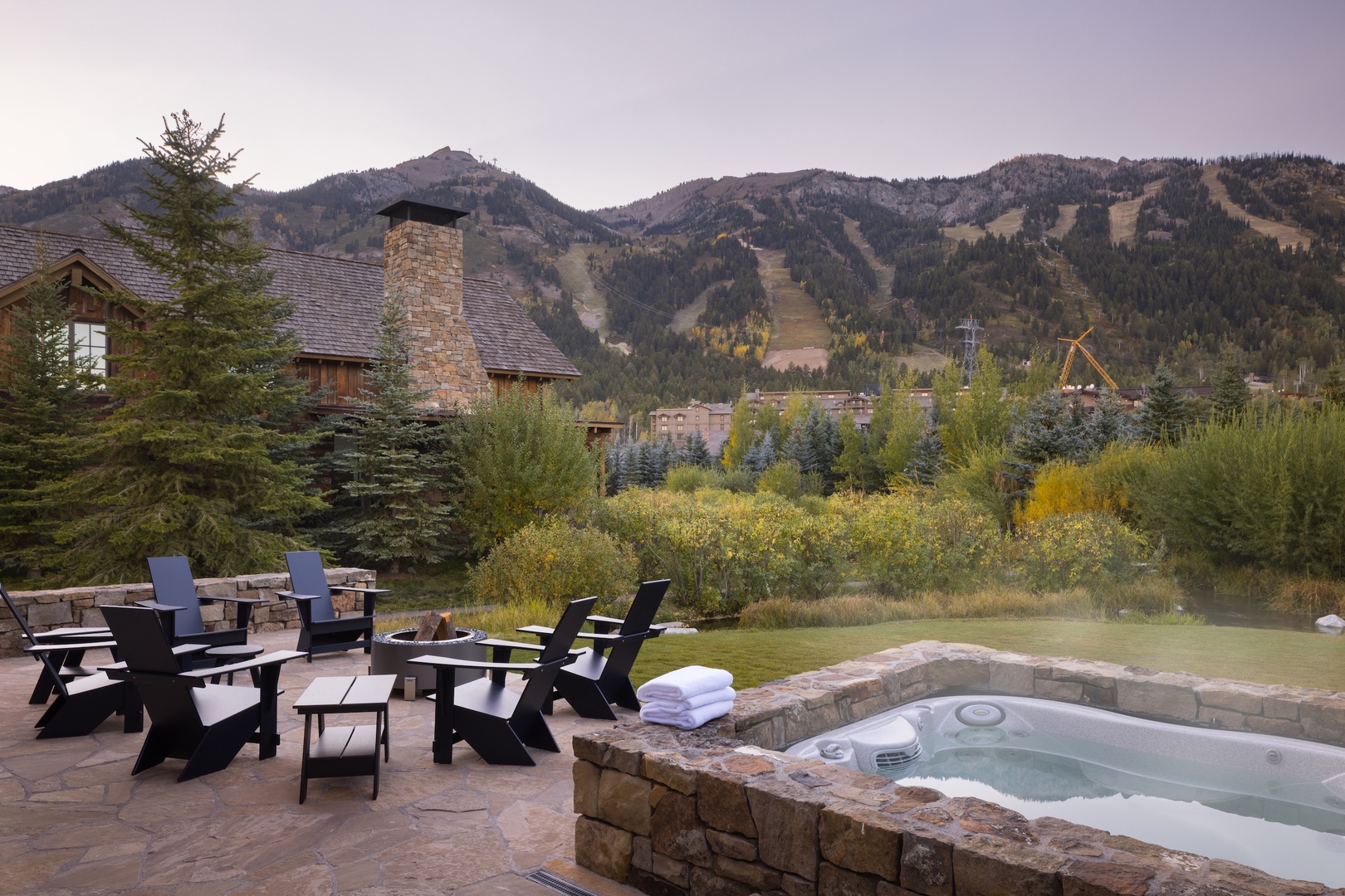 Private hot tub and outdoor dining with views of Jackson Hole Mountain Resort (summer)
