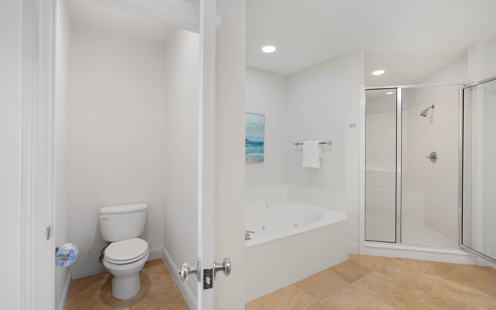 Unwind in your spacious bathroom with a luxurious soaking tub and separate glass shower for ultimate relaxation.